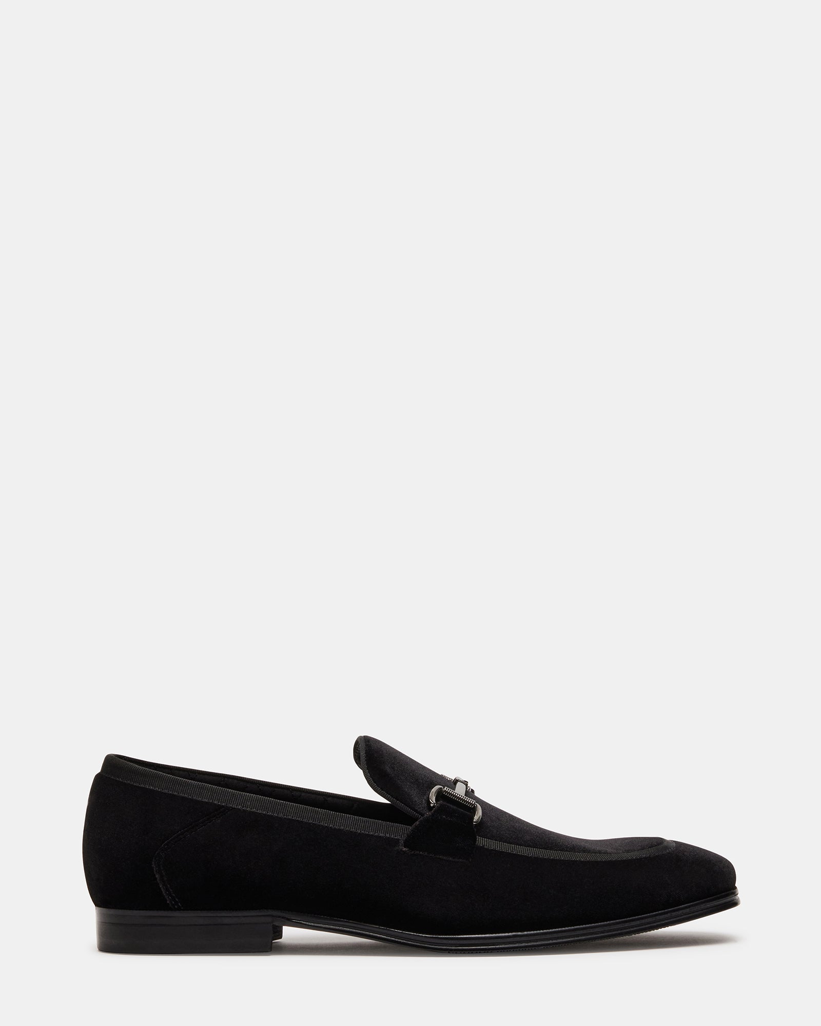 Side view of black silver velvet heels showing texture and heel height
