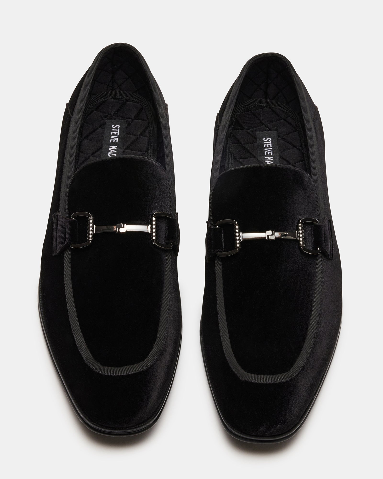 Side view of black silver velvet heels showing texture and heel height