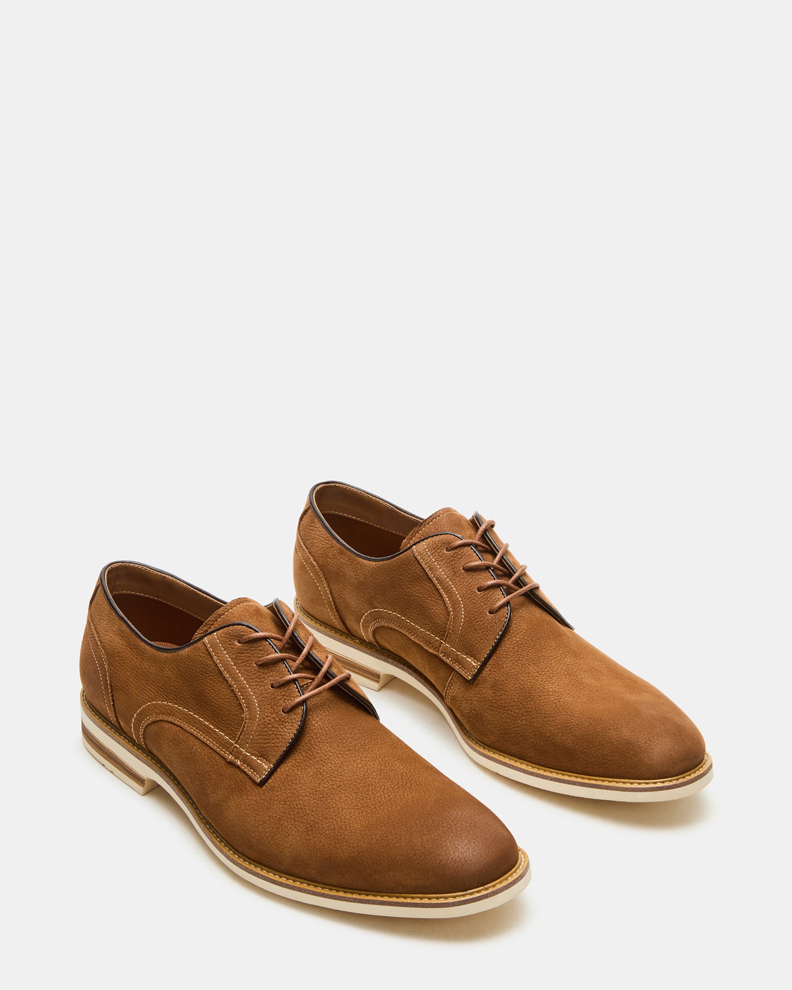 Close-up of the lace-up design of Alvarez dress shoes in tan nubuck.