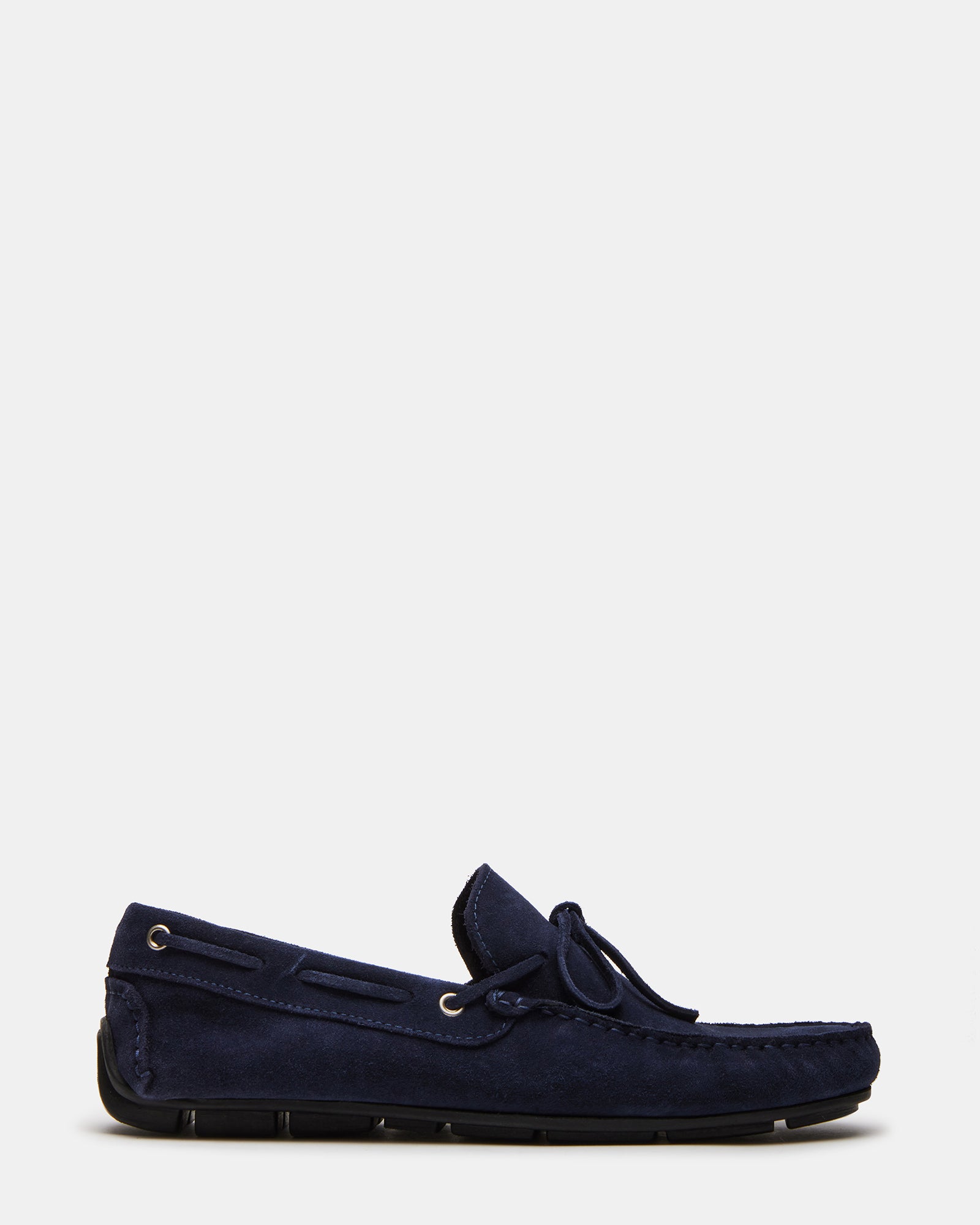 Side view of navy dress shoes highlighting suede texture and rubber sole.