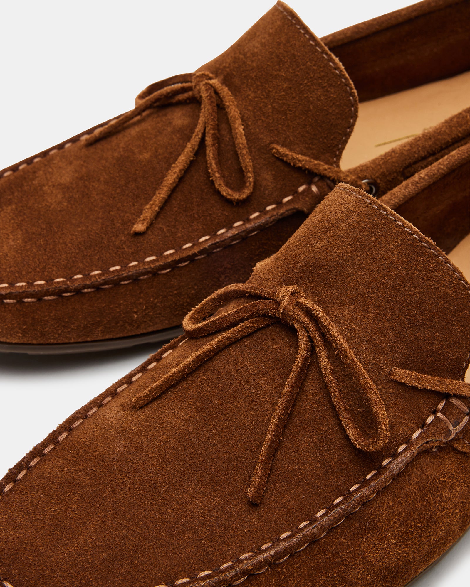 Close-up of the rubber sole on Amalfi suede loafers for durability.