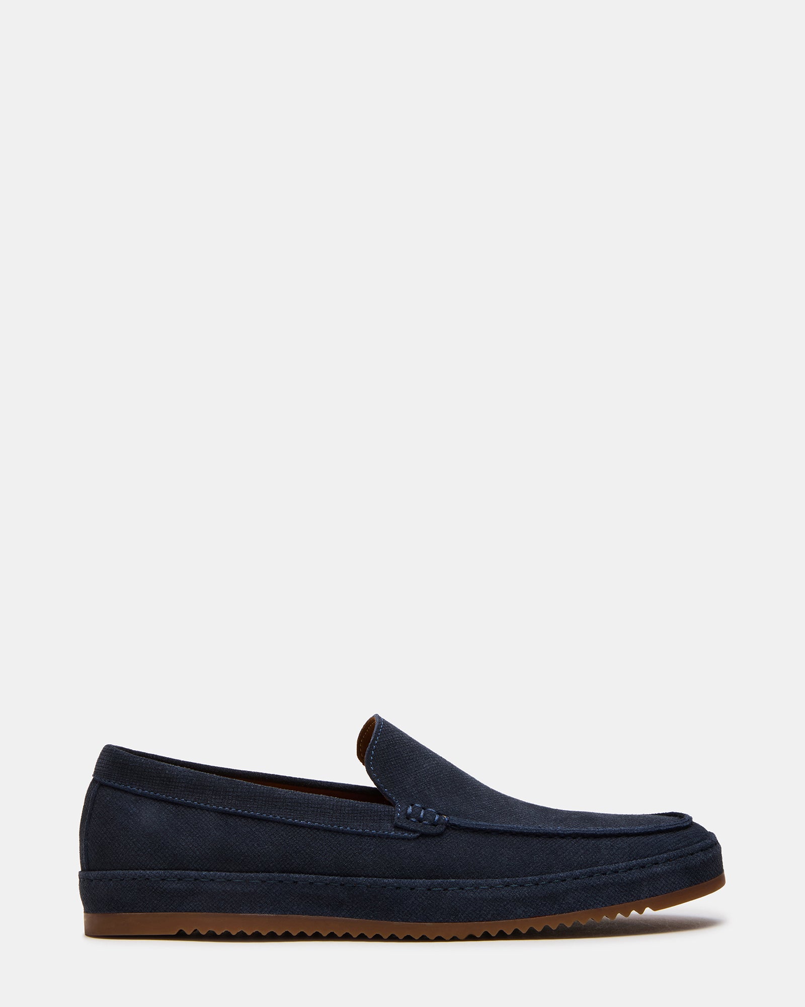 Navy suede loafers with slip-on style on a wooden surface for casual wear