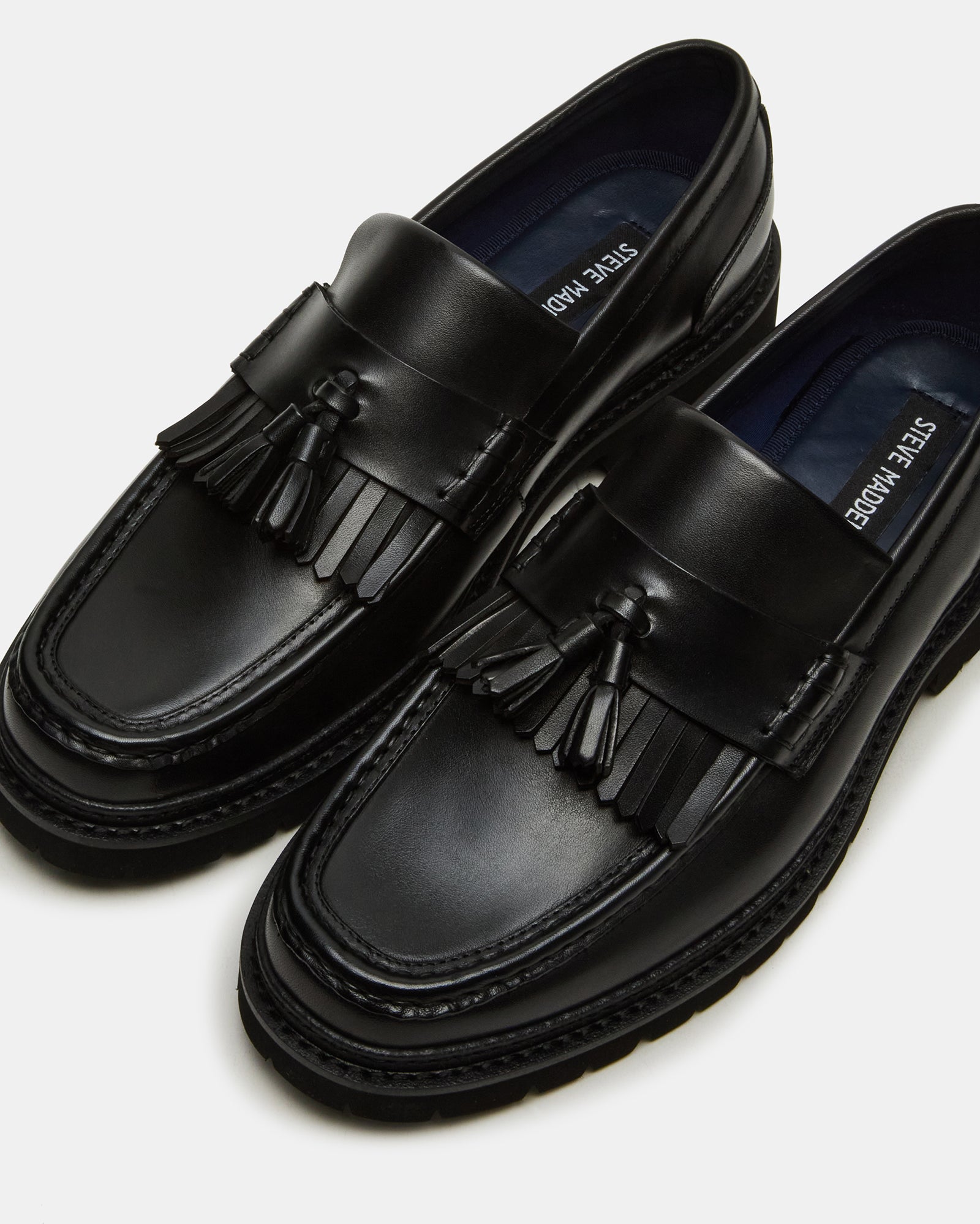 Front view of Arthus black loafers, showcasing elegant tassel detail.