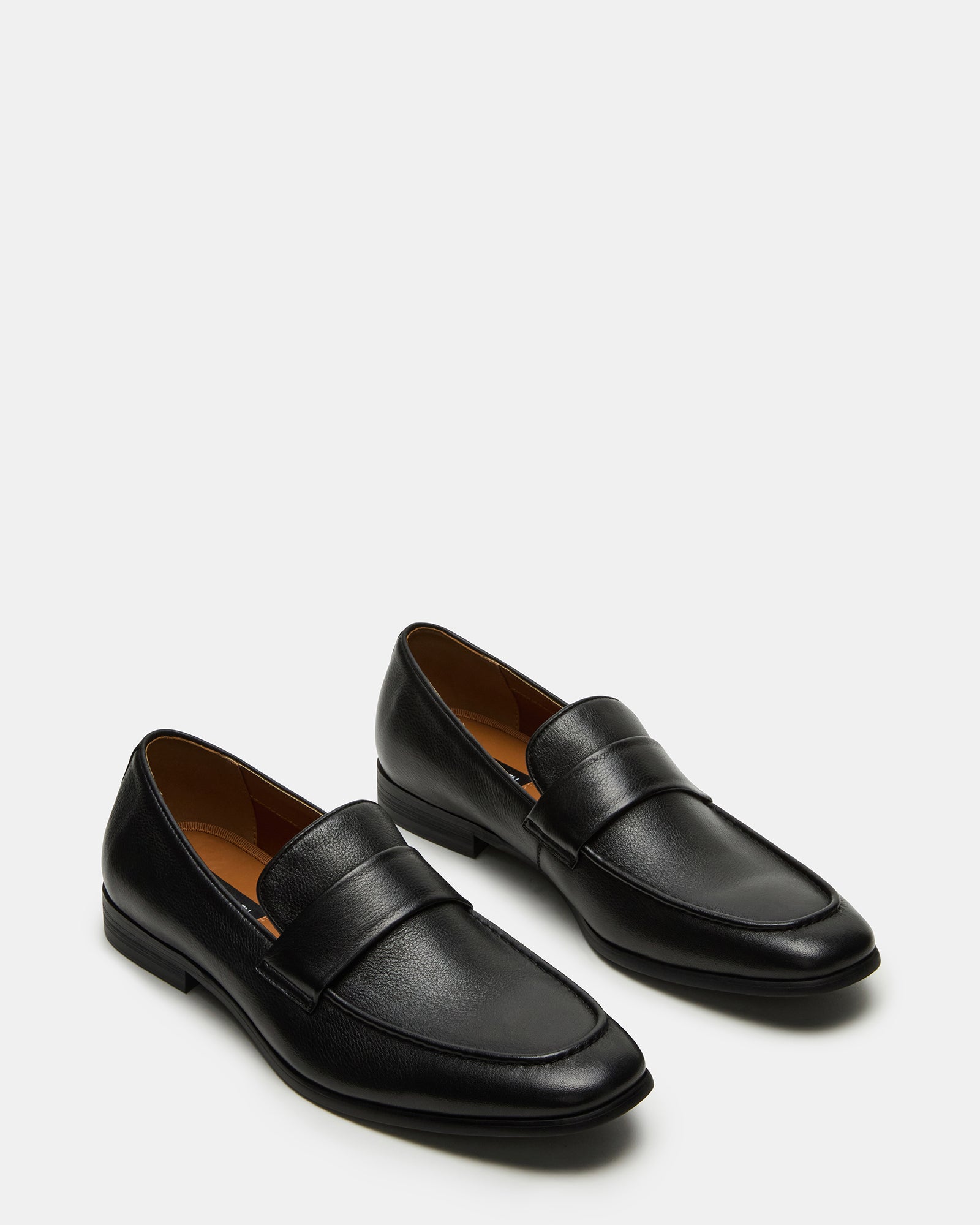 Side profile of Biscuit loafers highlighting sleek design and stitching