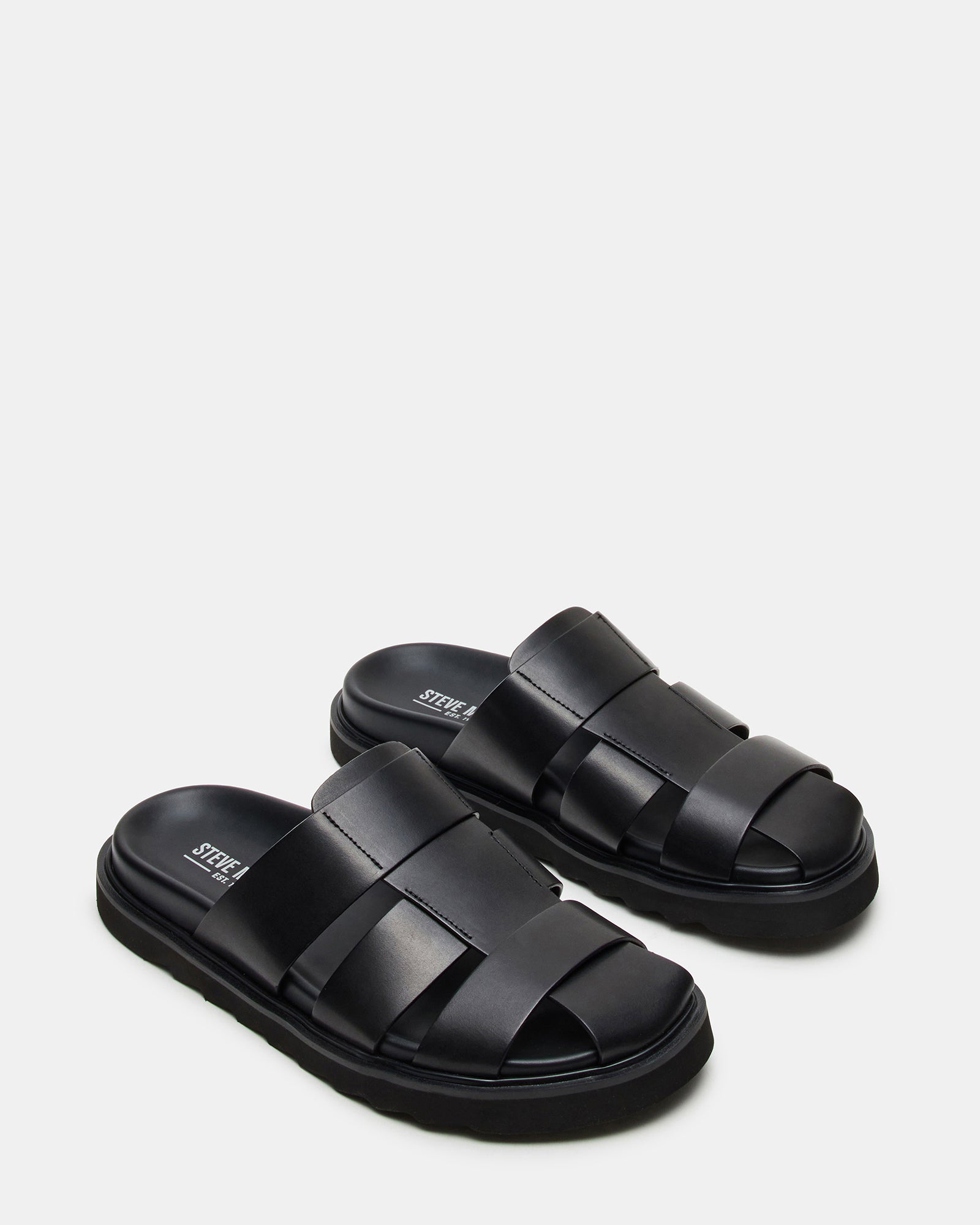Side view of black leather sandals highlighting comfort design