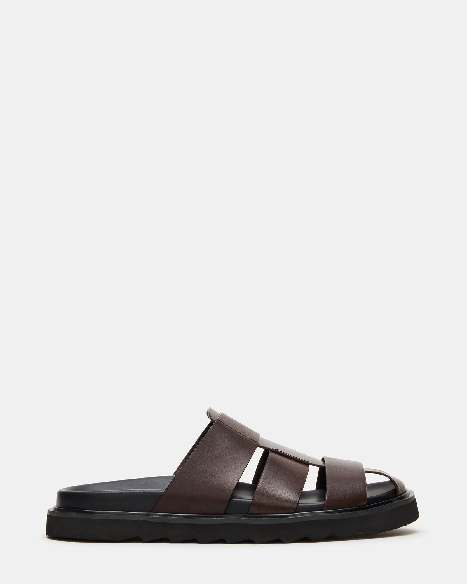 Pair of brown leather fisherman sandals with supportive sole, ideal for outdoor adventures