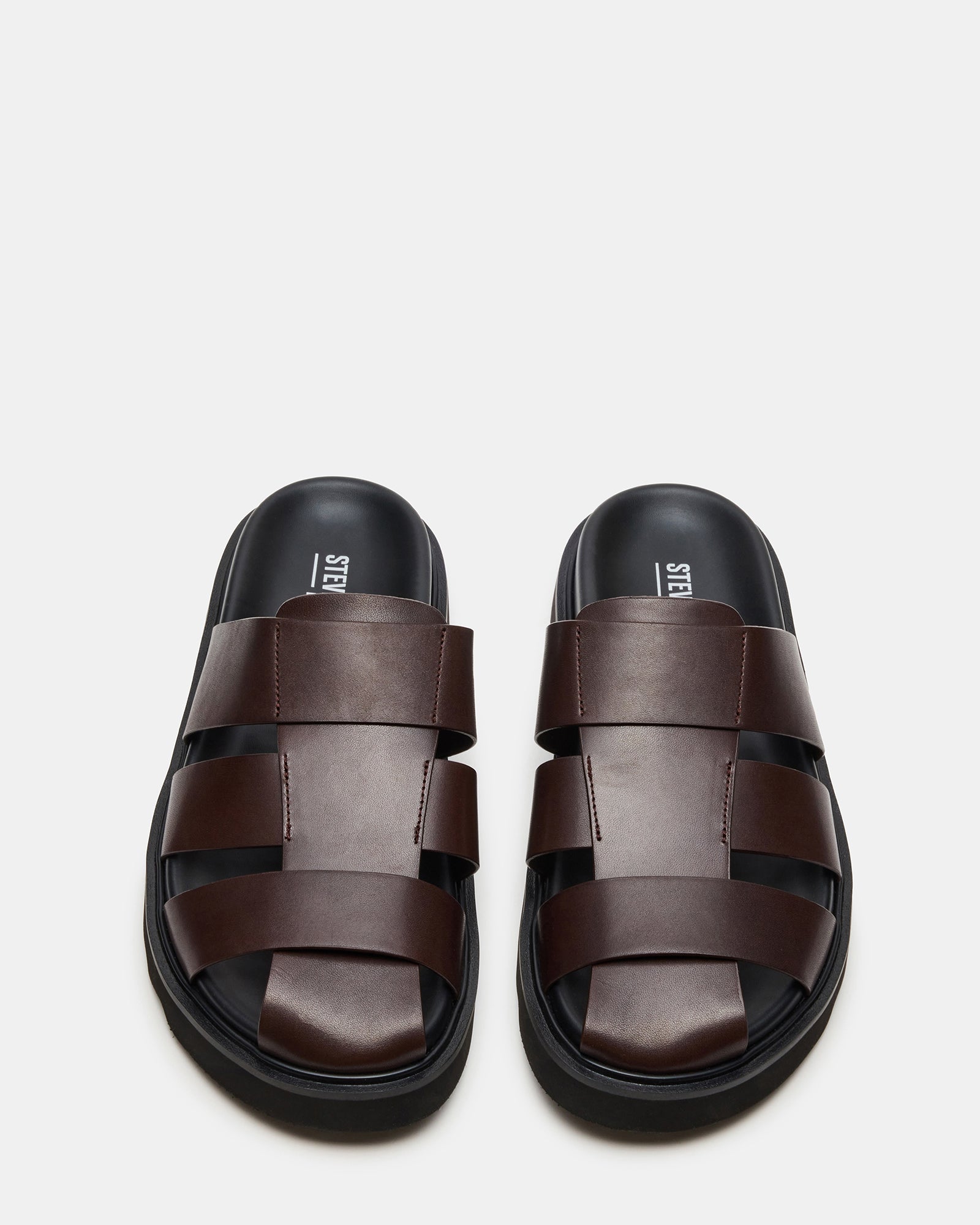 Pair of brown leather fisherman sandals with supportive sole, ideal for outdoor adventures