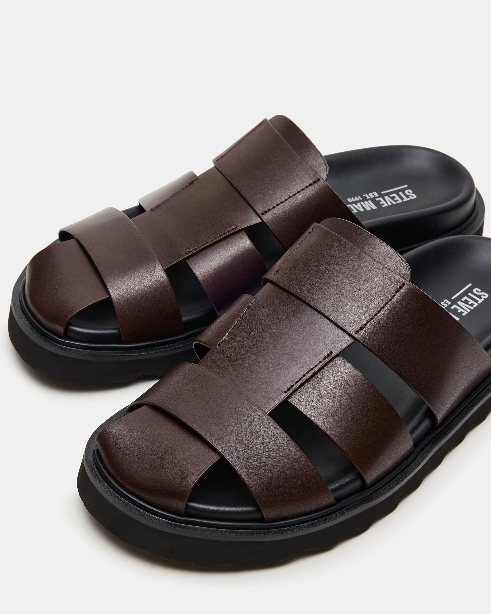 Lifestyle shot of women’s leather sandals for women paired with summer outfit