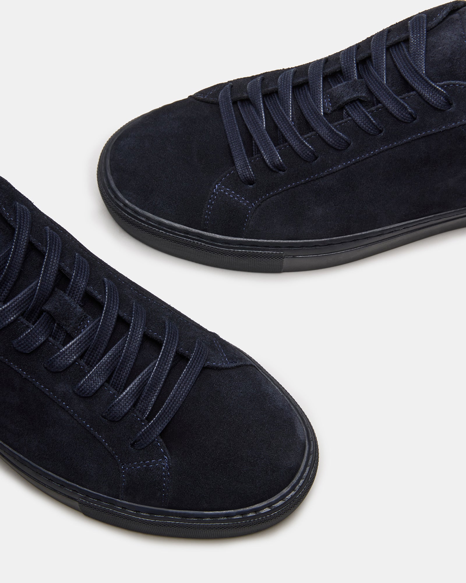 Casual outfit pairing with navy suede sneakers