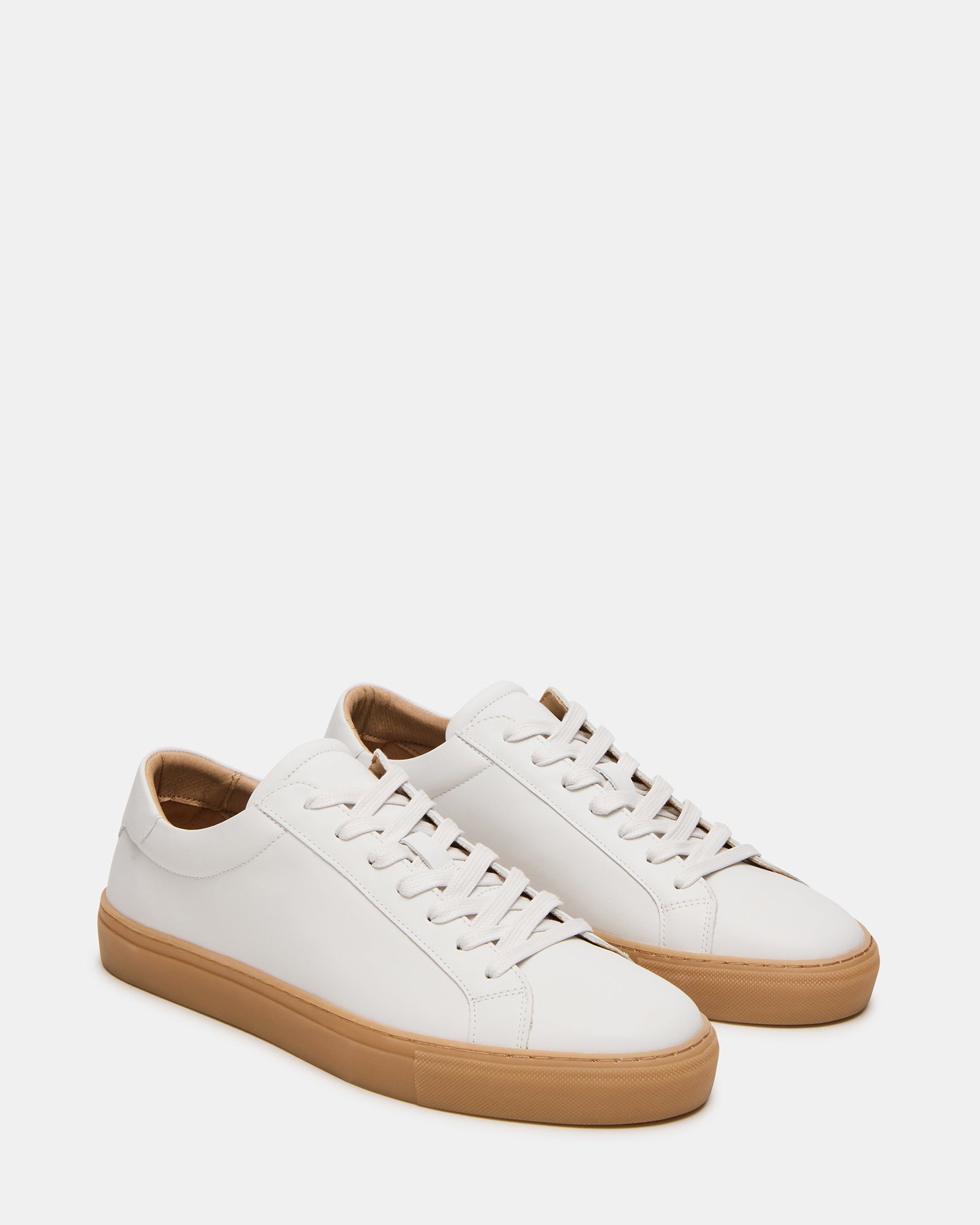 Top-down view showing sleek leather lacing on luxury sneakers