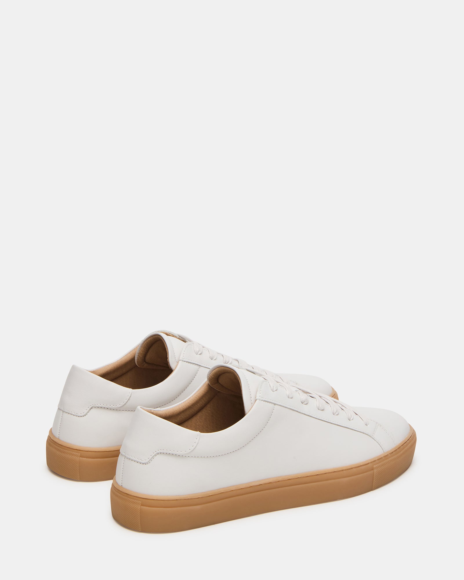 Top-down view showing sleek leather lacing on luxury sneakers