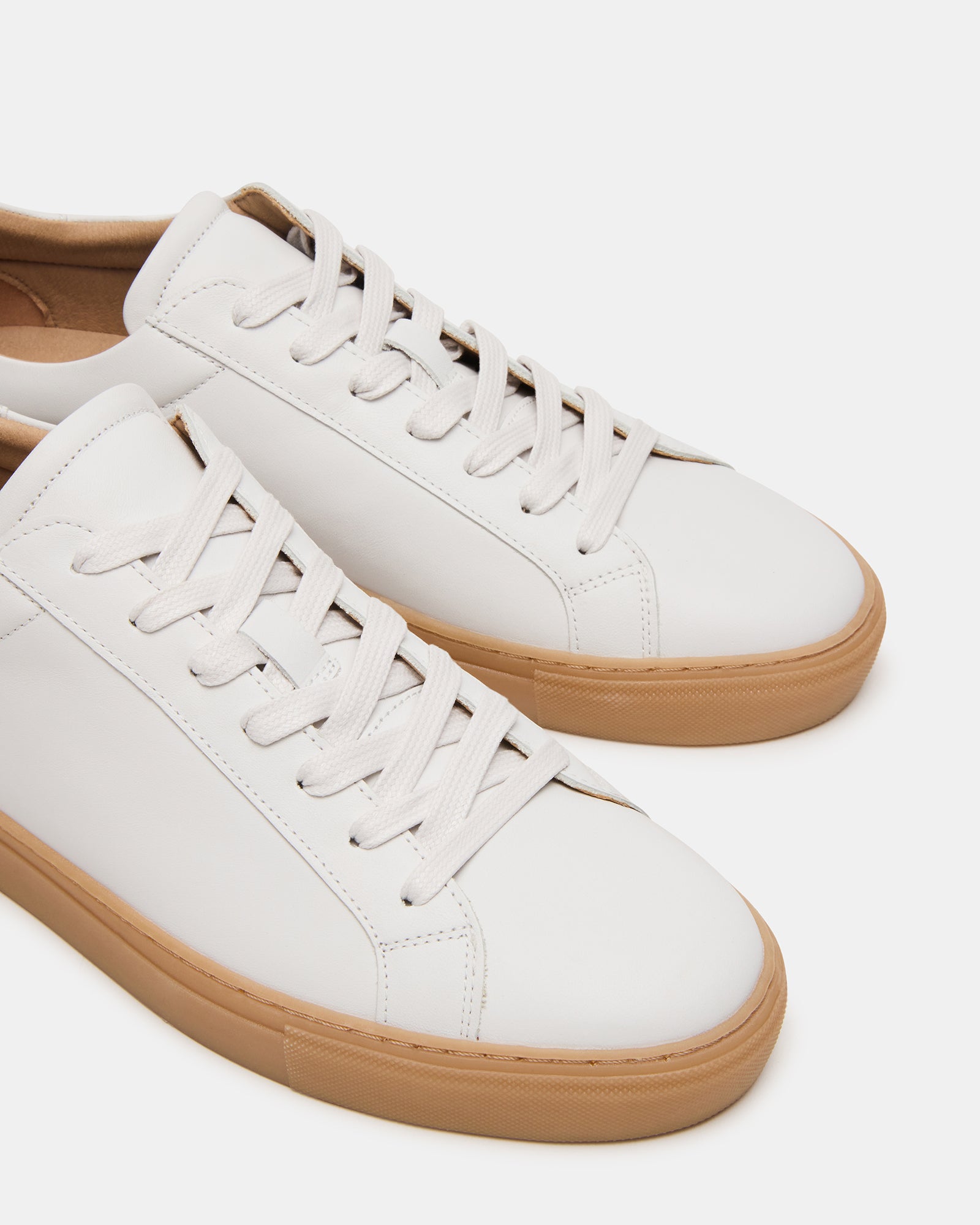 Close-up of rubber sole and camel heel accent for stylish contrast