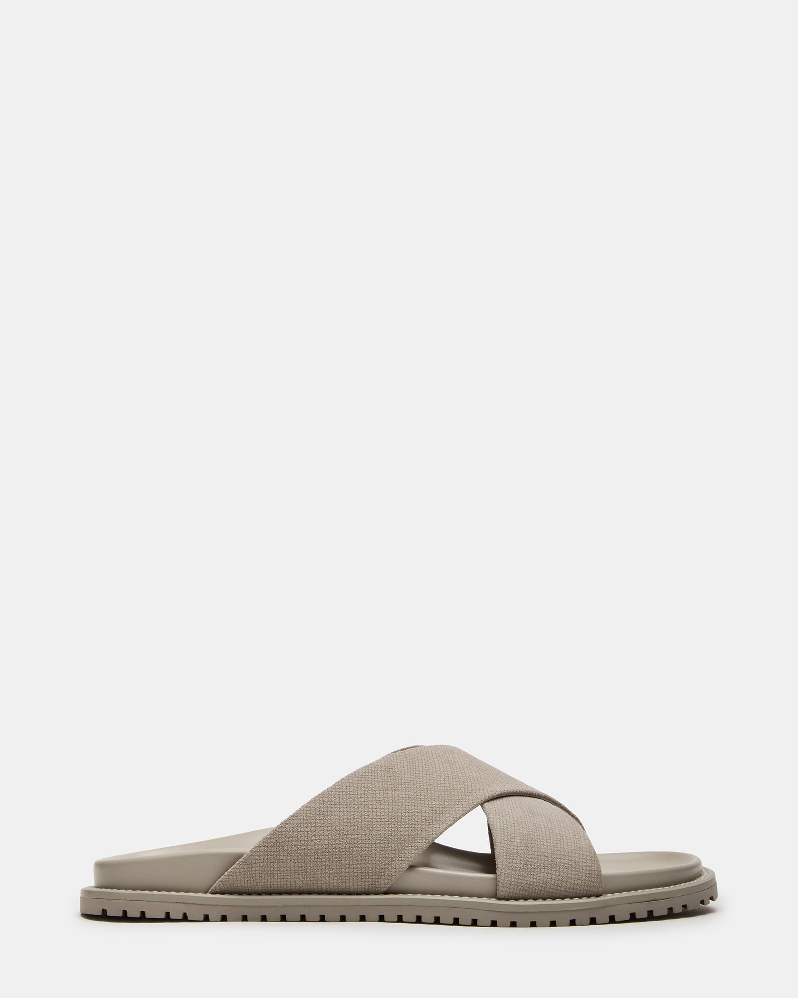 Gold flat sandals with crisscross design, perfect for summer outings.