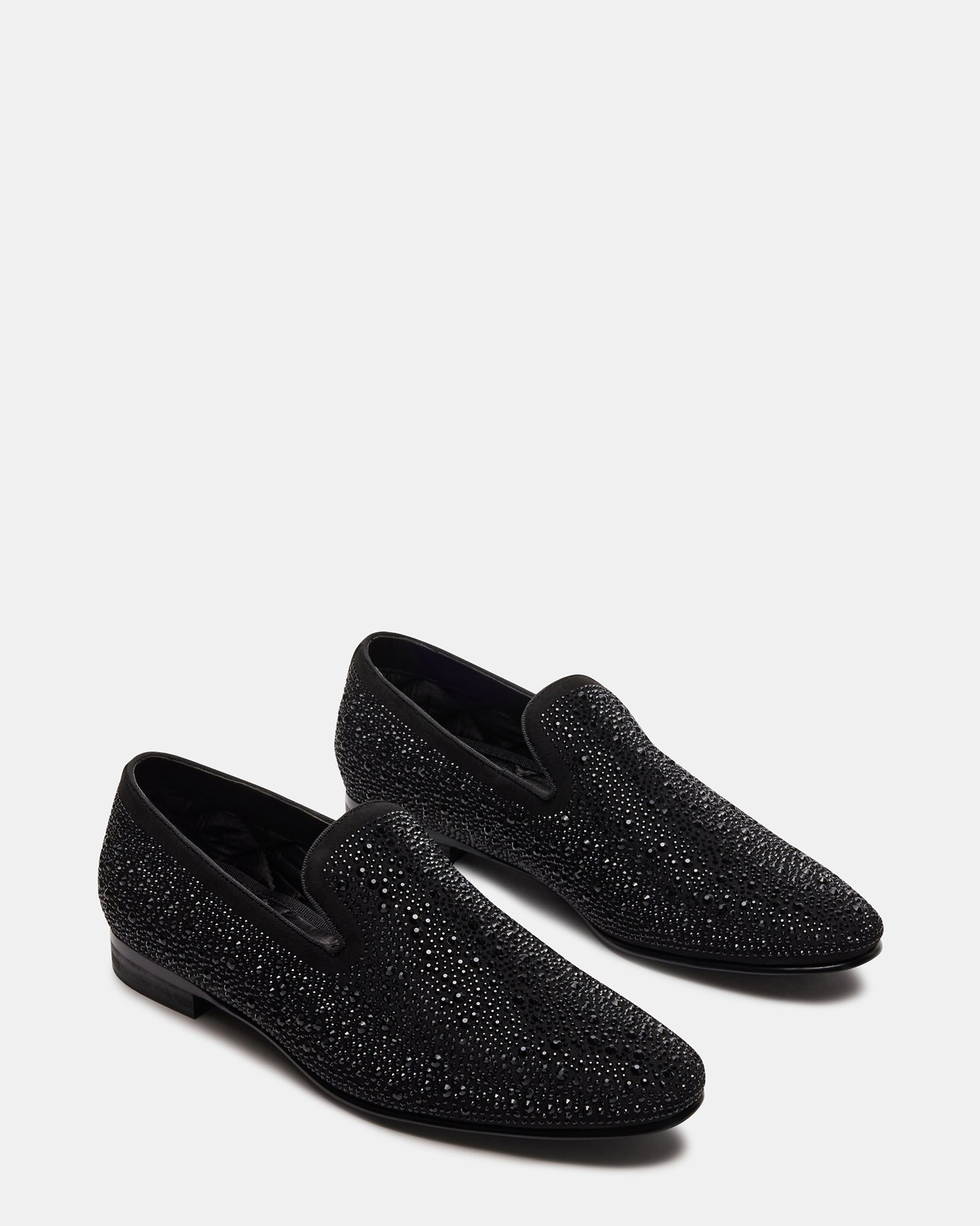 Side view of loafers with rhinestones on a styled outfit for brunch