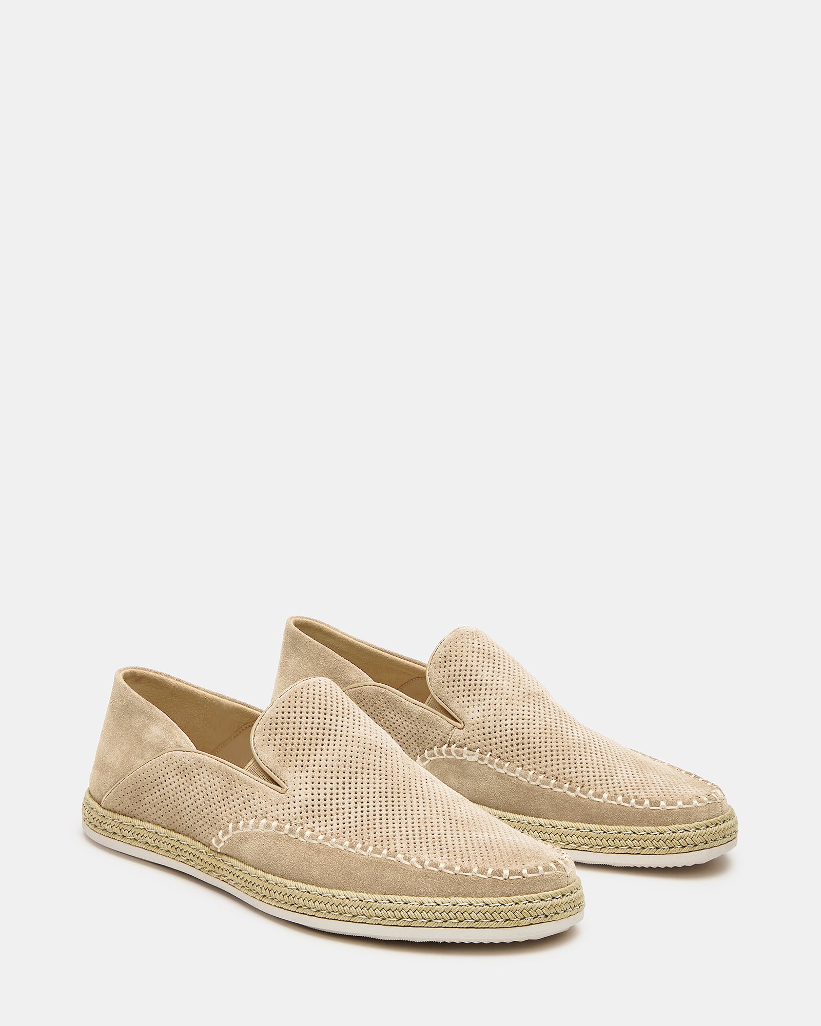 Lifestyle shot of loafers worn with relaxed jeans in downtown setting