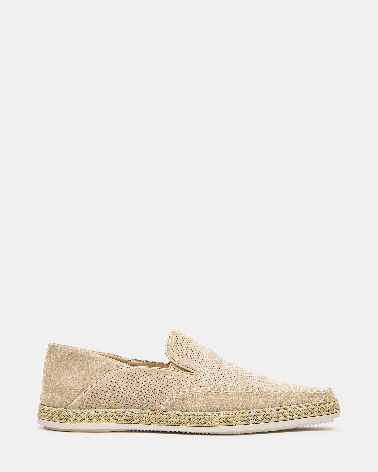 Side view of penny loafers showing suede texture and low heel