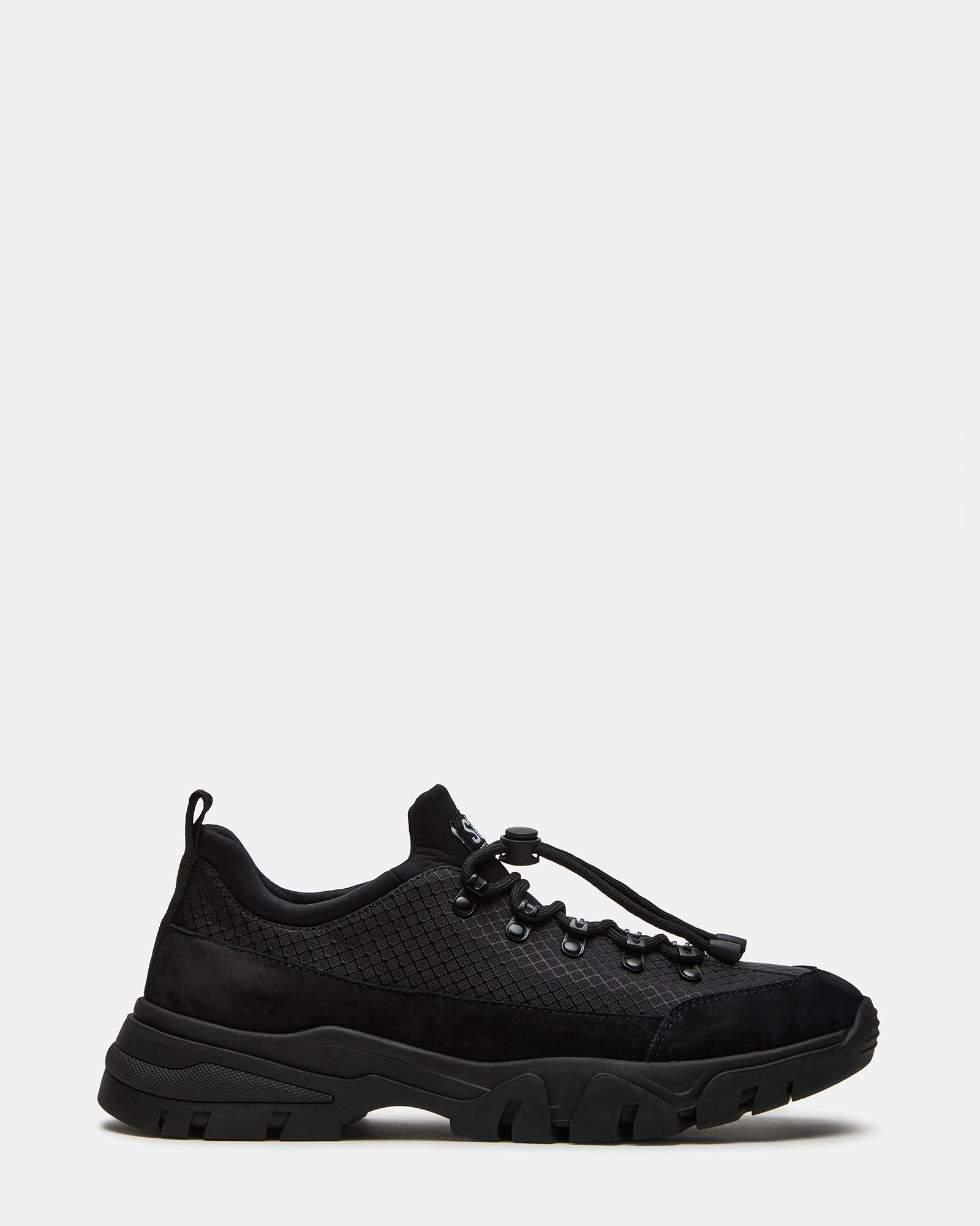 Side view of the Chasley Black hiking shoes on a trail for women