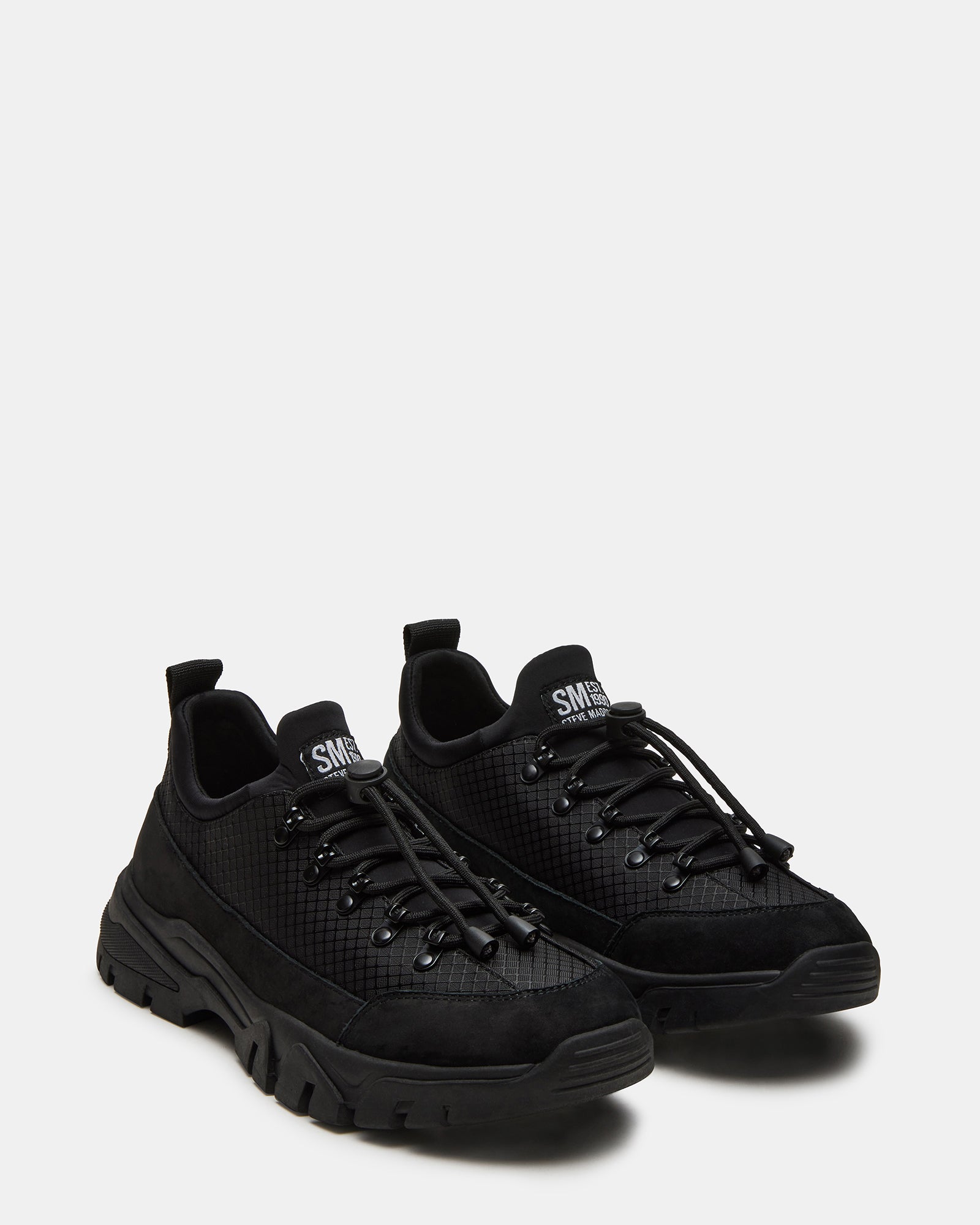 Close-up of the lace-up design and pull-tie closure of Chasley Black sneakers