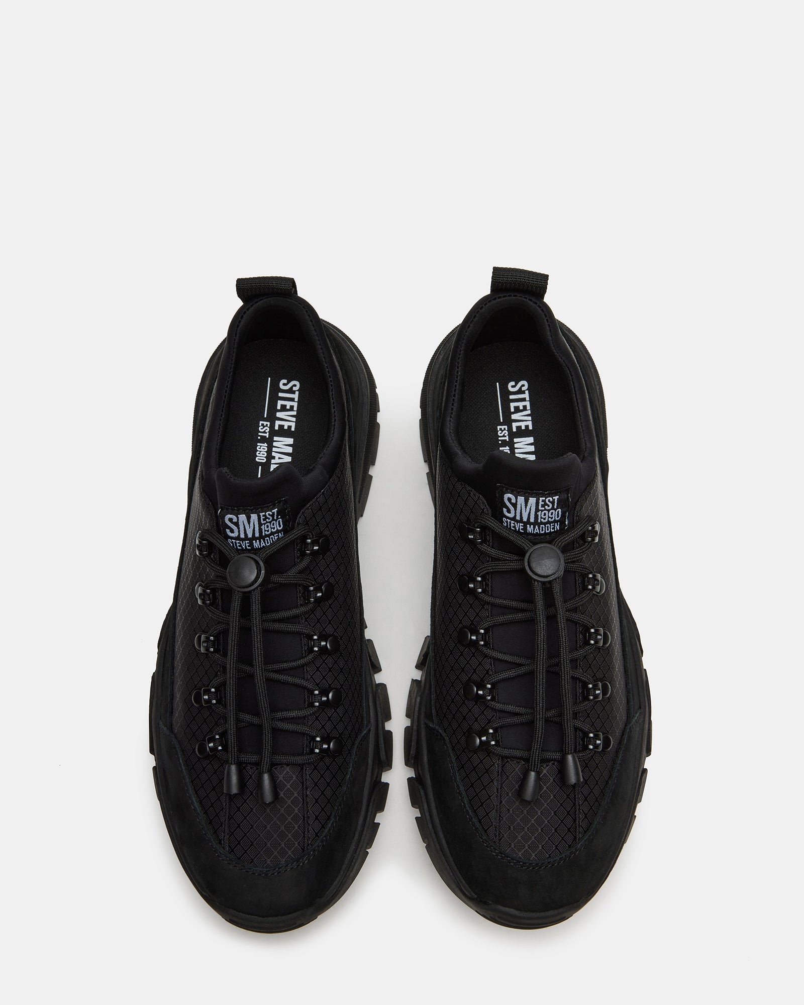 Side view of the Chasley Black hiking shoes on a trail for women