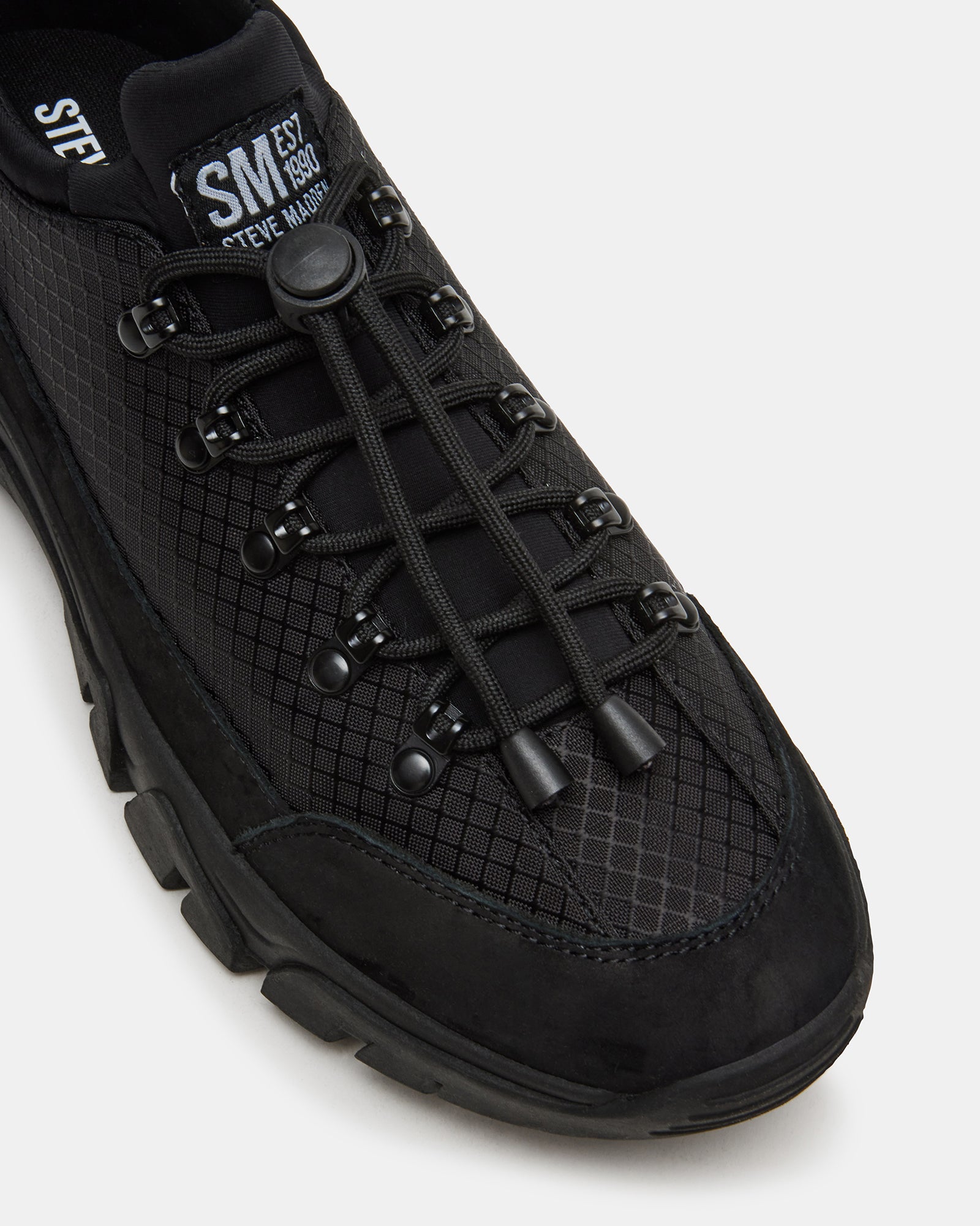 Chasley Black hiking shoes styled with outdoor apparel during a hike