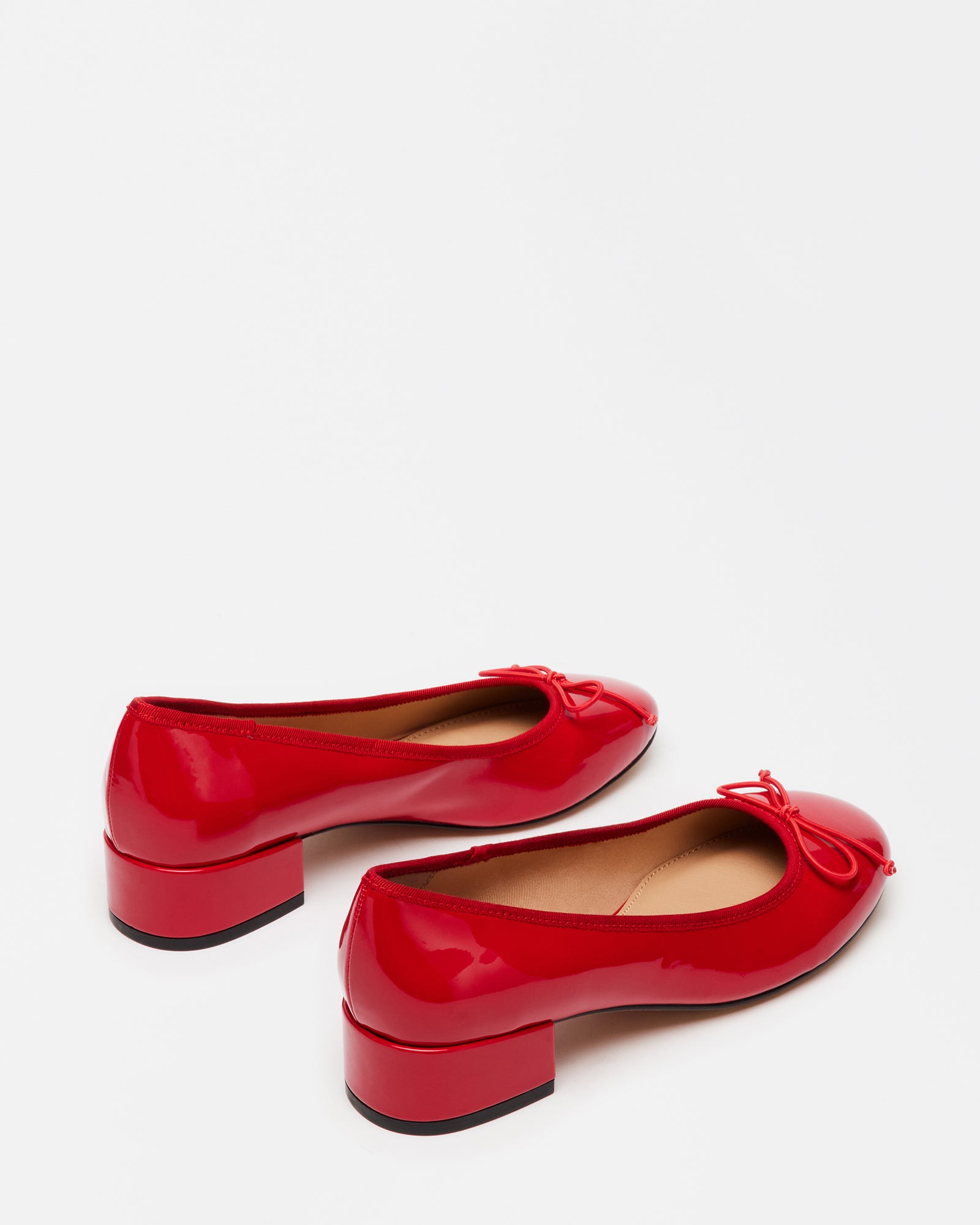 Cherish low heel bridesmaid shoes in red patent shown on hardwood floor