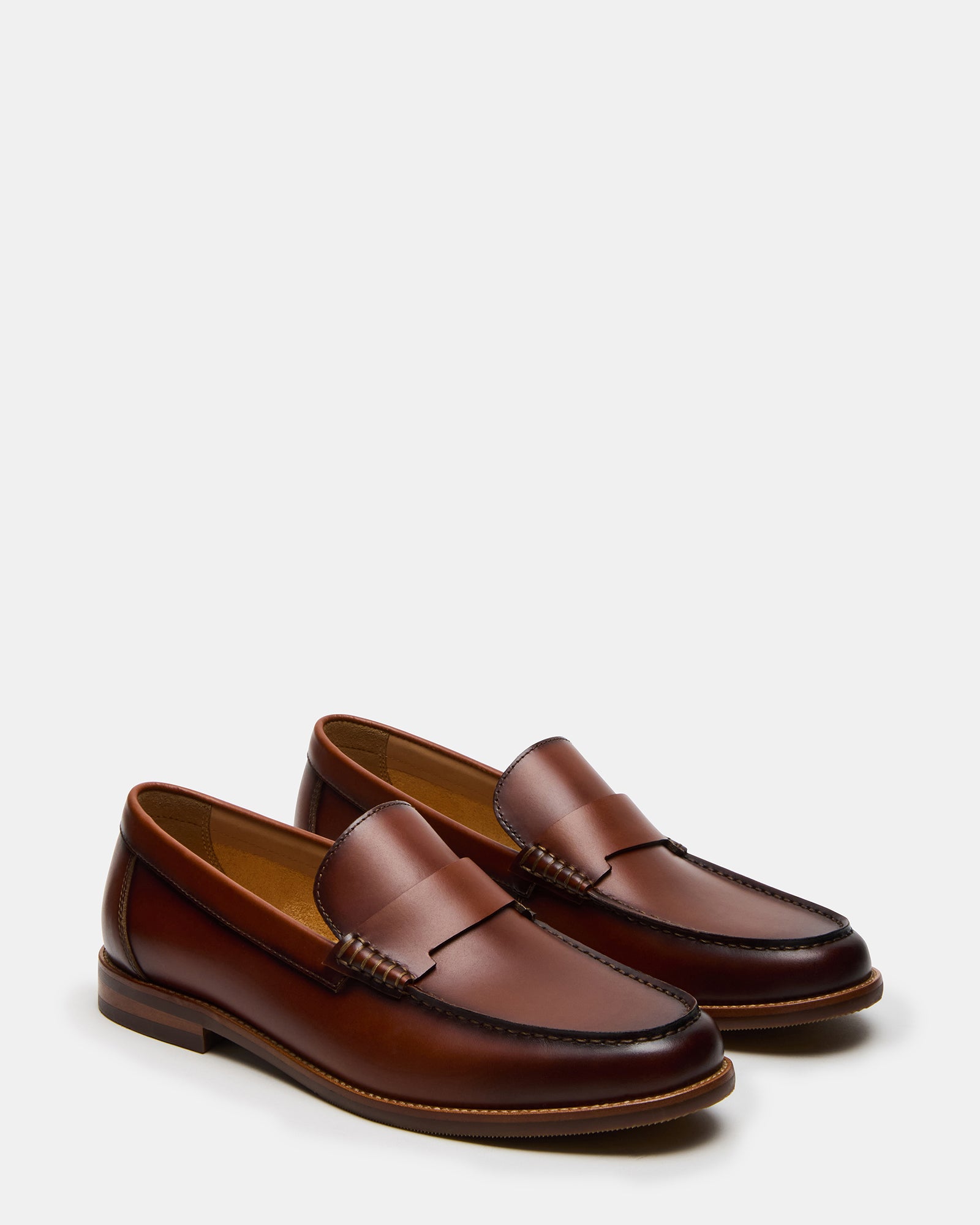 Casual setting showcasing leather slip-on shoes for men paired with smart attire.