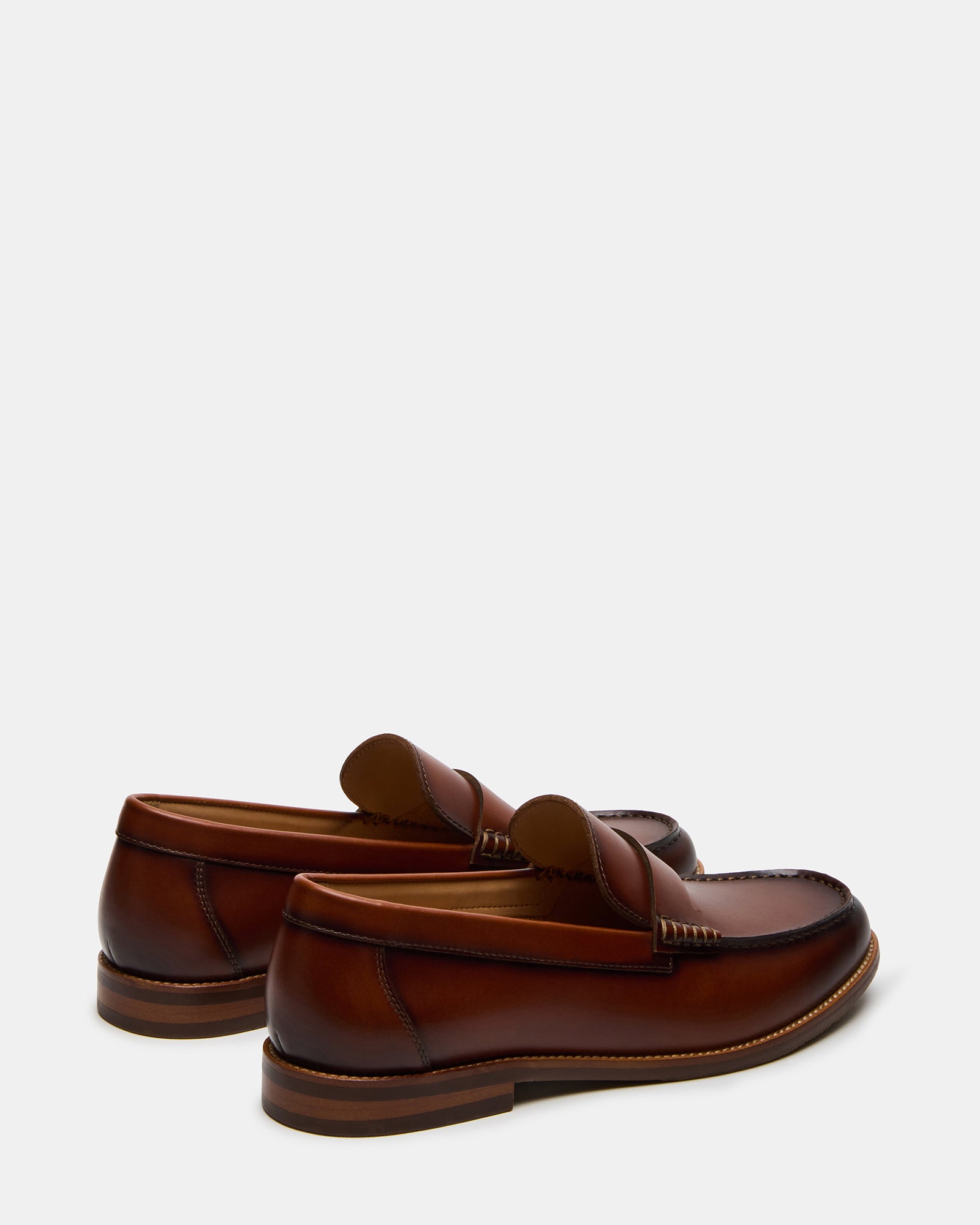 Casual setting showcasing leather slip-on shoes for men paired with smart attire.