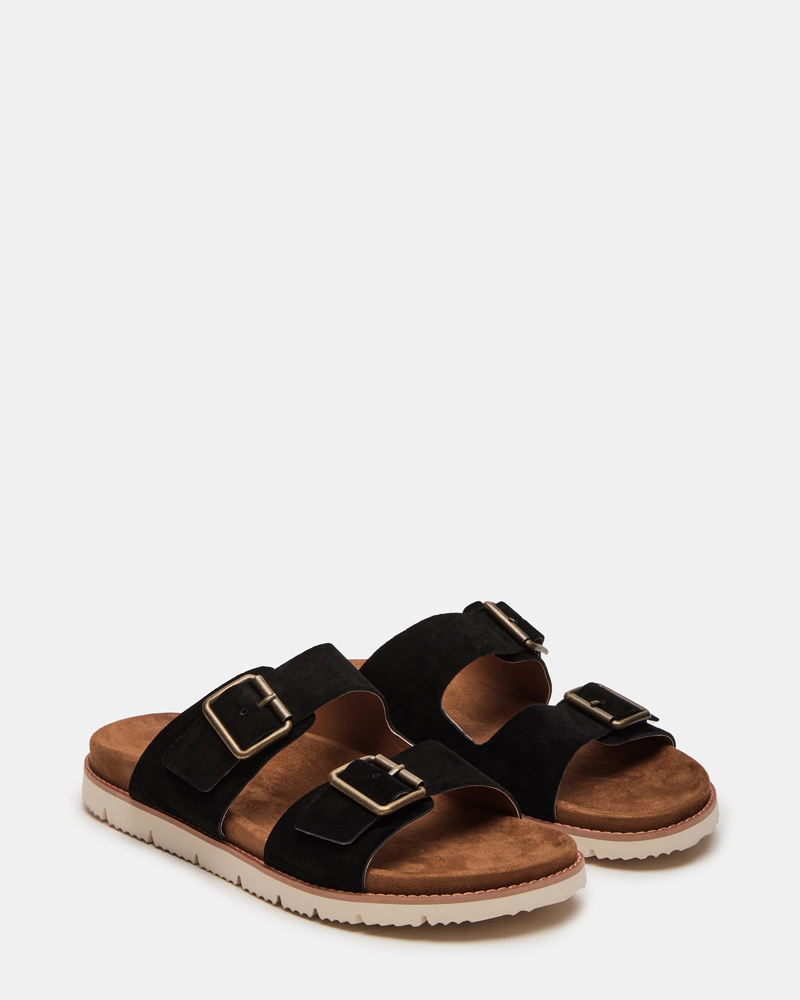Side angle of comfortable sandals styled with casual jeans near Knoxville’s Market Square