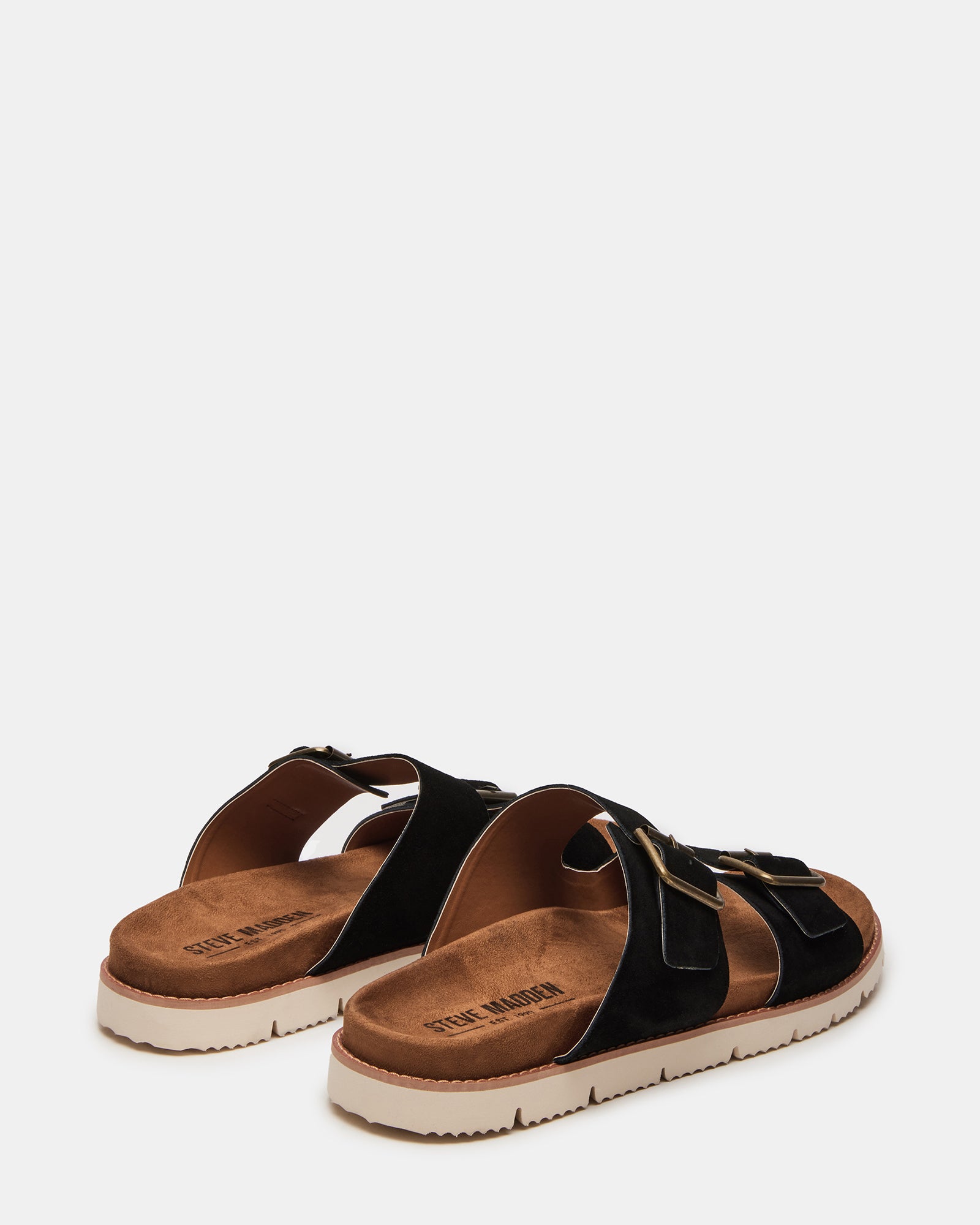 Side angle of comfortable sandals styled with casual jeans near Knoxville’s Market Square