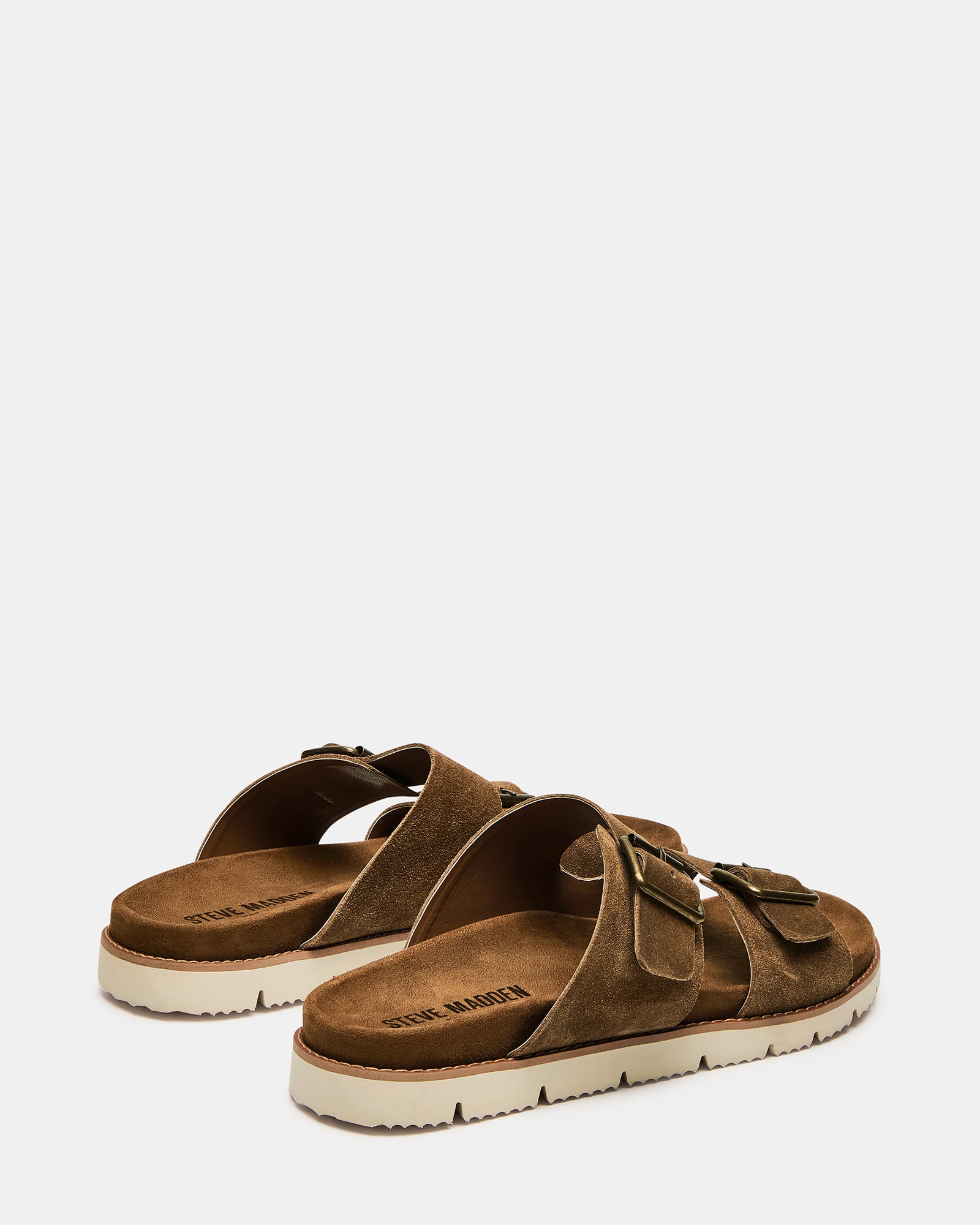 Close-up of buckle closure on suede sandals