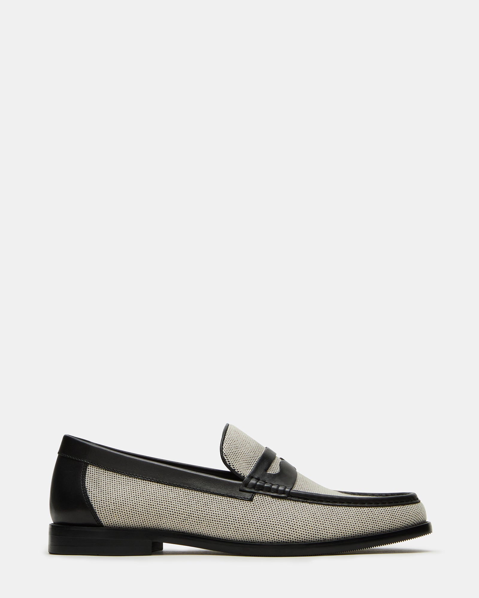 Close-up of black dress shoes highlighting the loafer silhouette and rubber sole