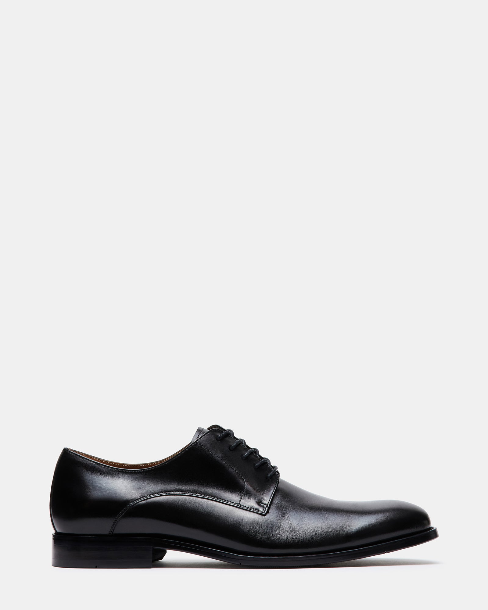 Close-up of black leather derby shoes with polished finish, showcasing detailed lacing