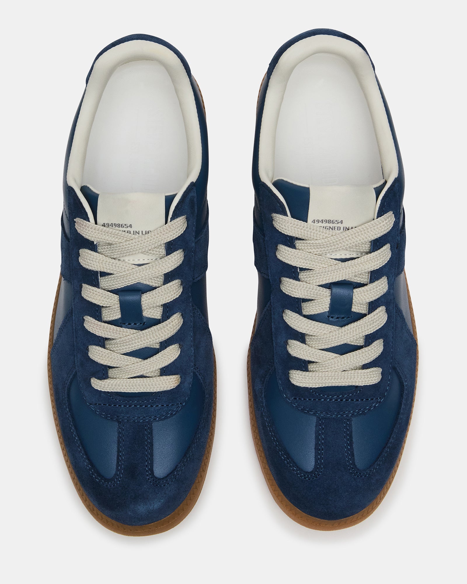 Close-up of the DIXON navy suede sneakers textured surface, emphasizing quality craftsmanship.