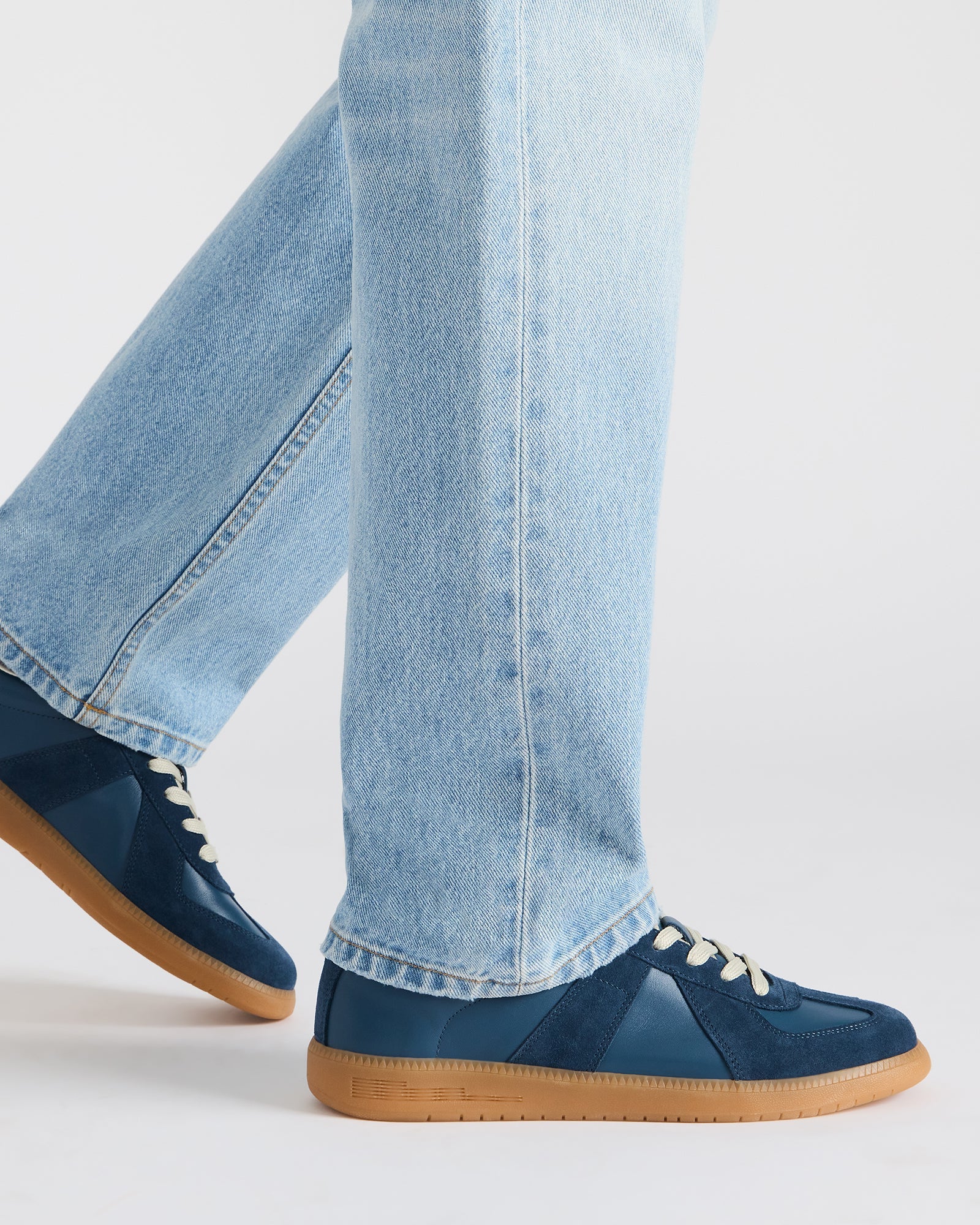 Close-up of the DIXON navy suede sneakers textured surface, emphasizing quality craftsmanship.