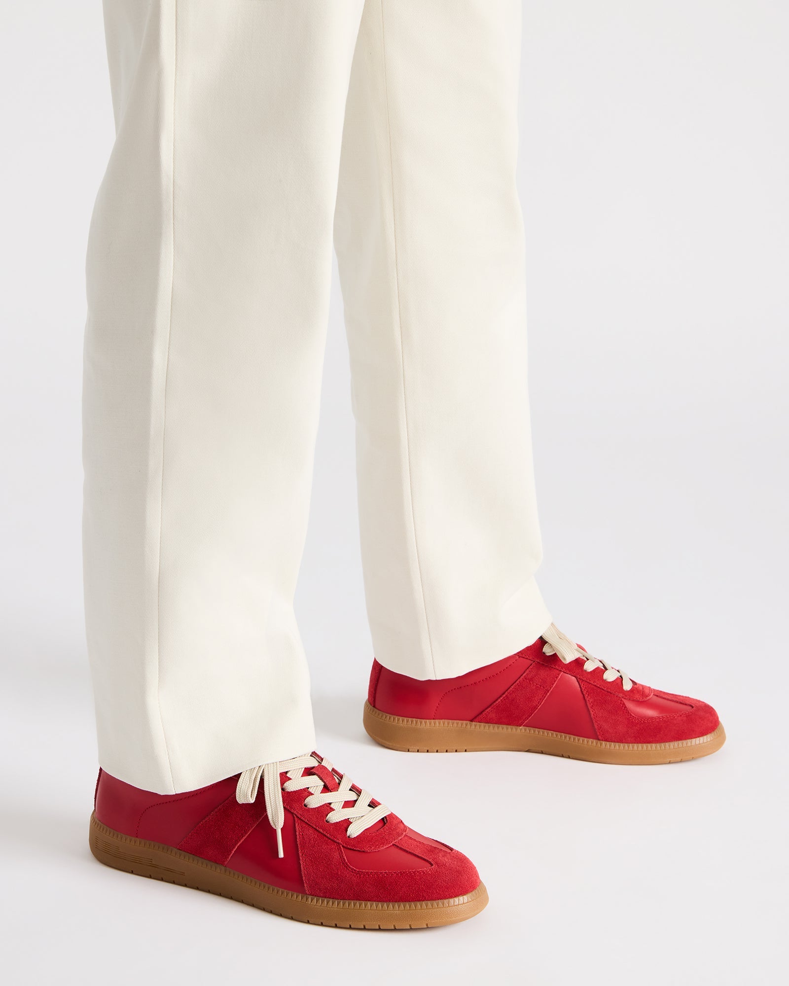 White casual shoes paired with chinos for a business casual outfit