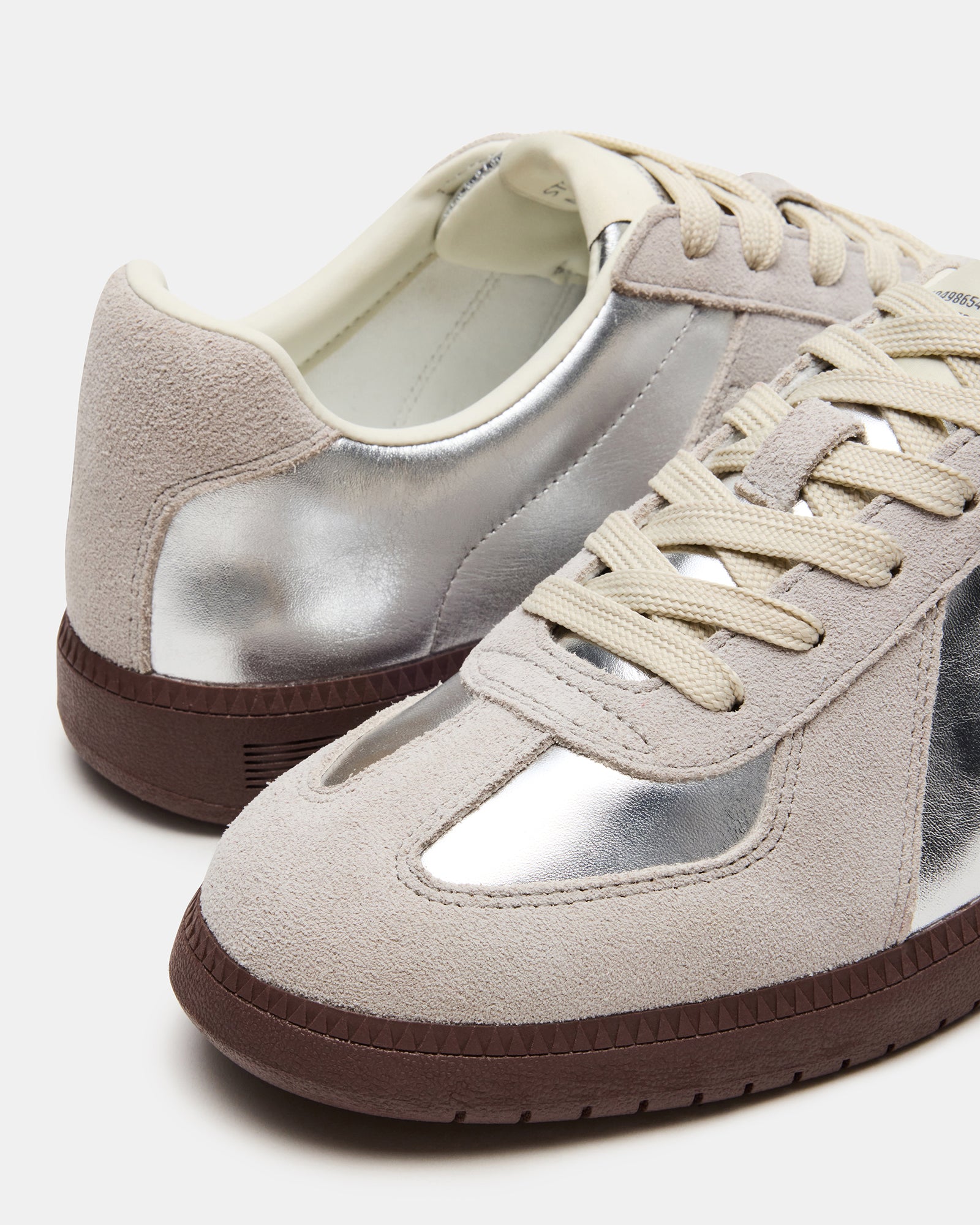 Dixon Silver white leather sneakers side profile on hardwood floor