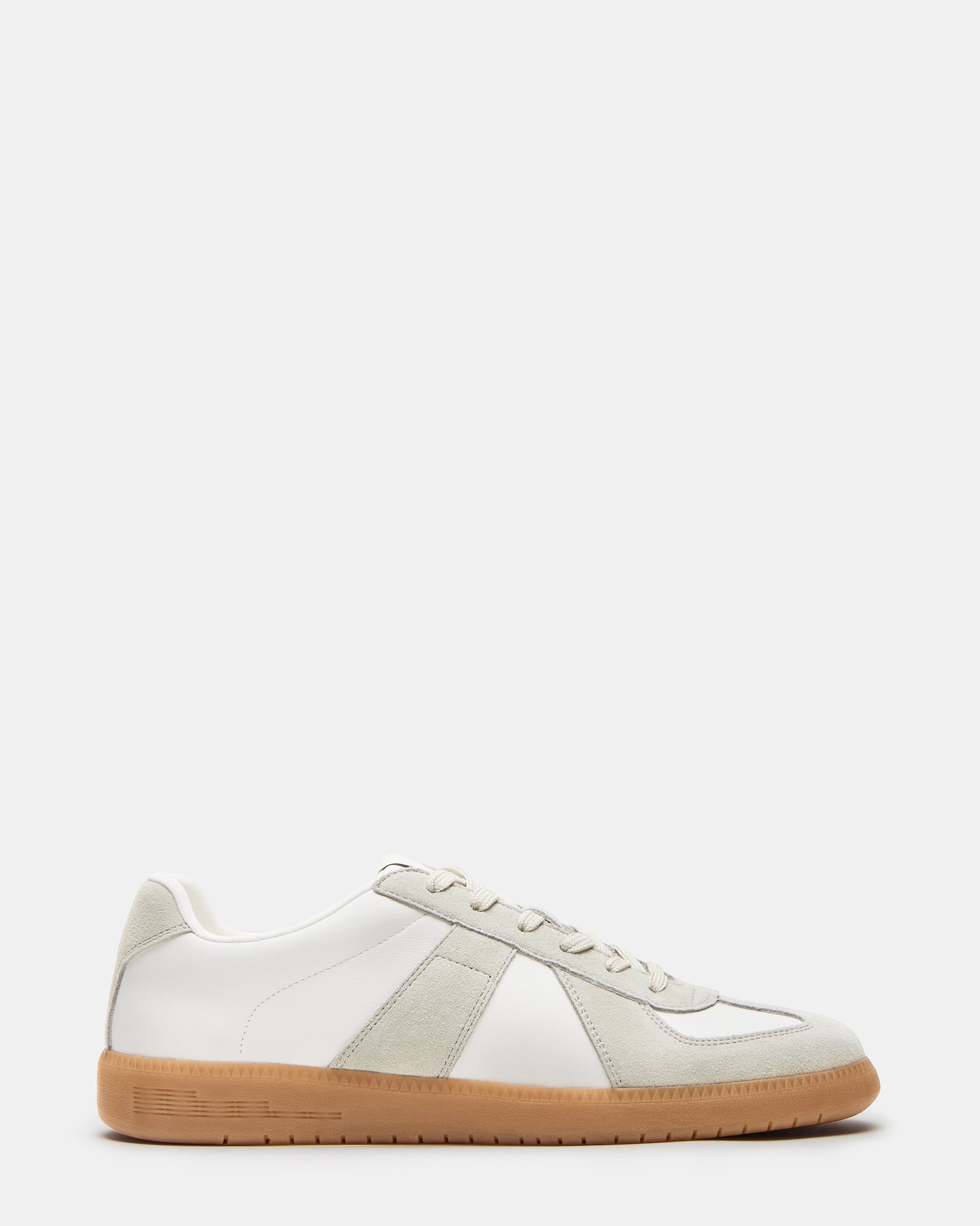 Side view of DIXON low-top sneakers showing suede and leather details