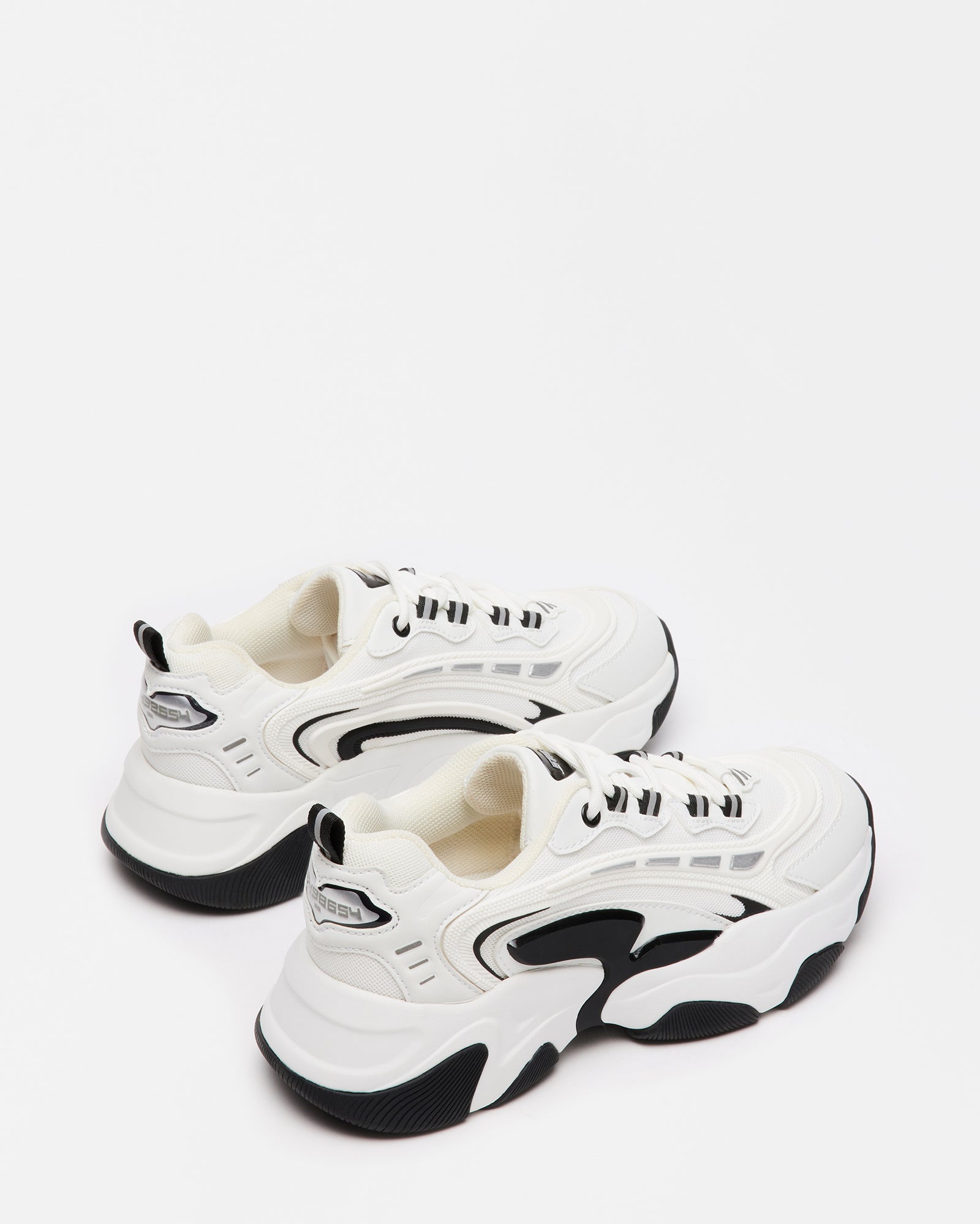 Side view of FLEX black and white chunky platform sneakers highlighting the bold sole