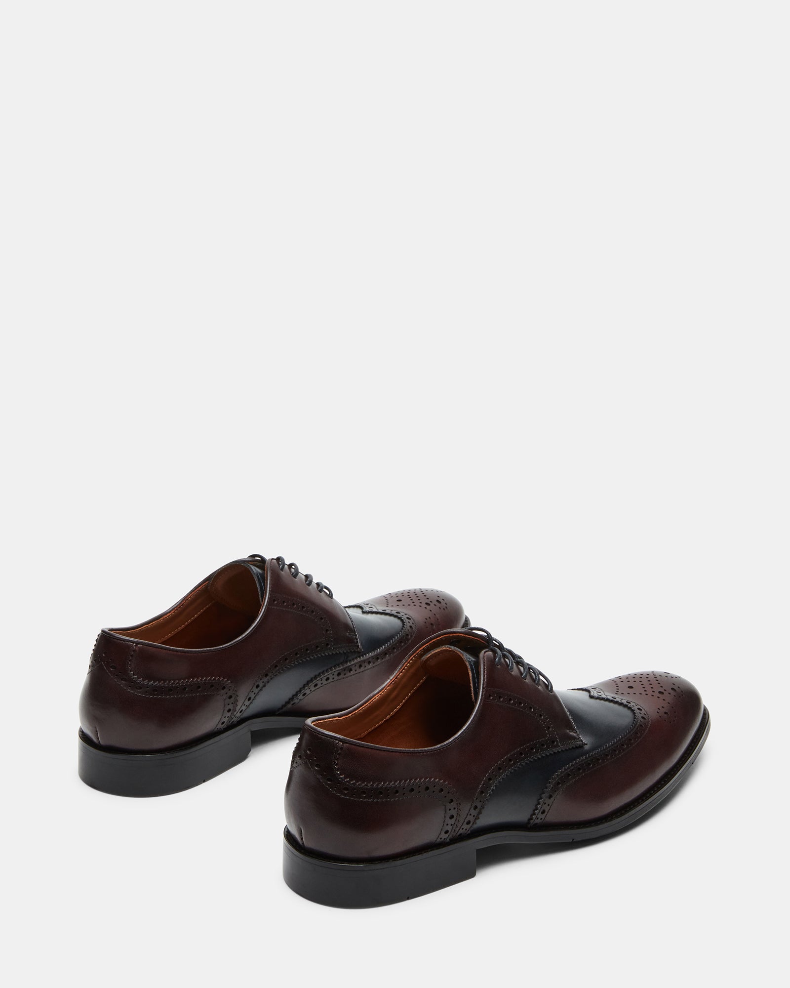 Close-up of burgundy dress shoes heel and stitching for premium look.