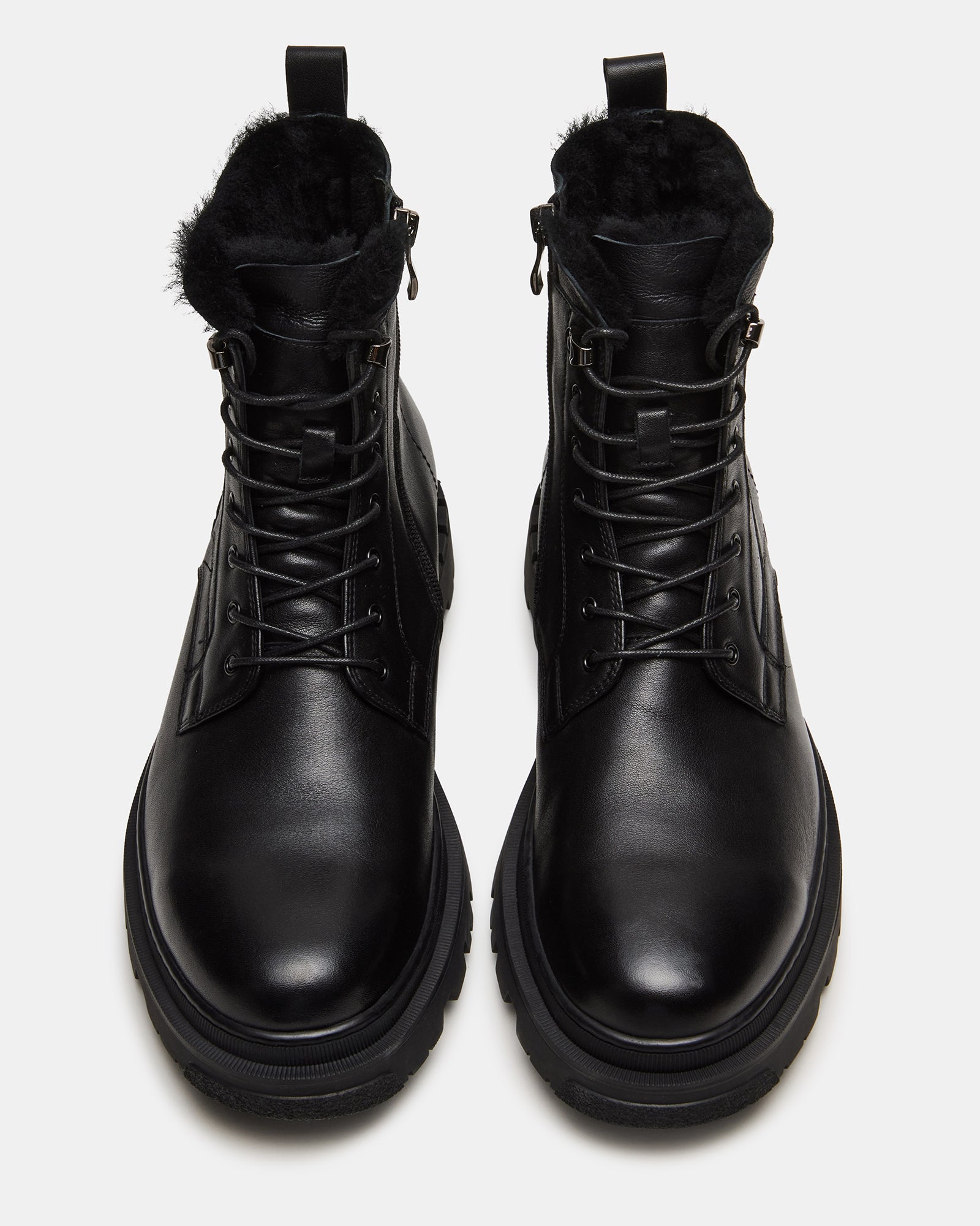 Side view of black leather boots with lug sole, perfect for casual and dress wear