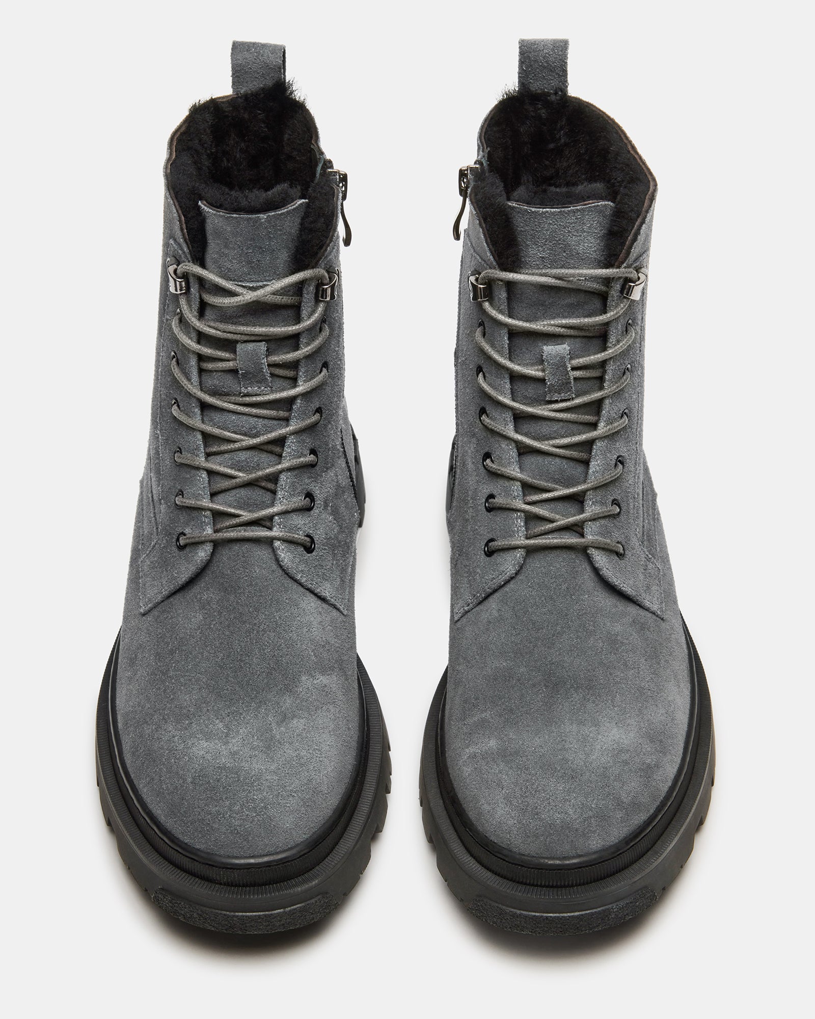 Side view of grey suede cowboy boots with lace-up and zip closure
