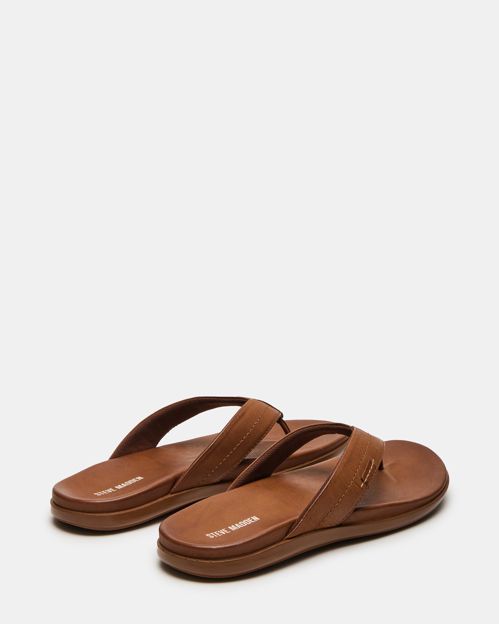 Close-up of the soft tumbled leather upper of EMMETT sandals.