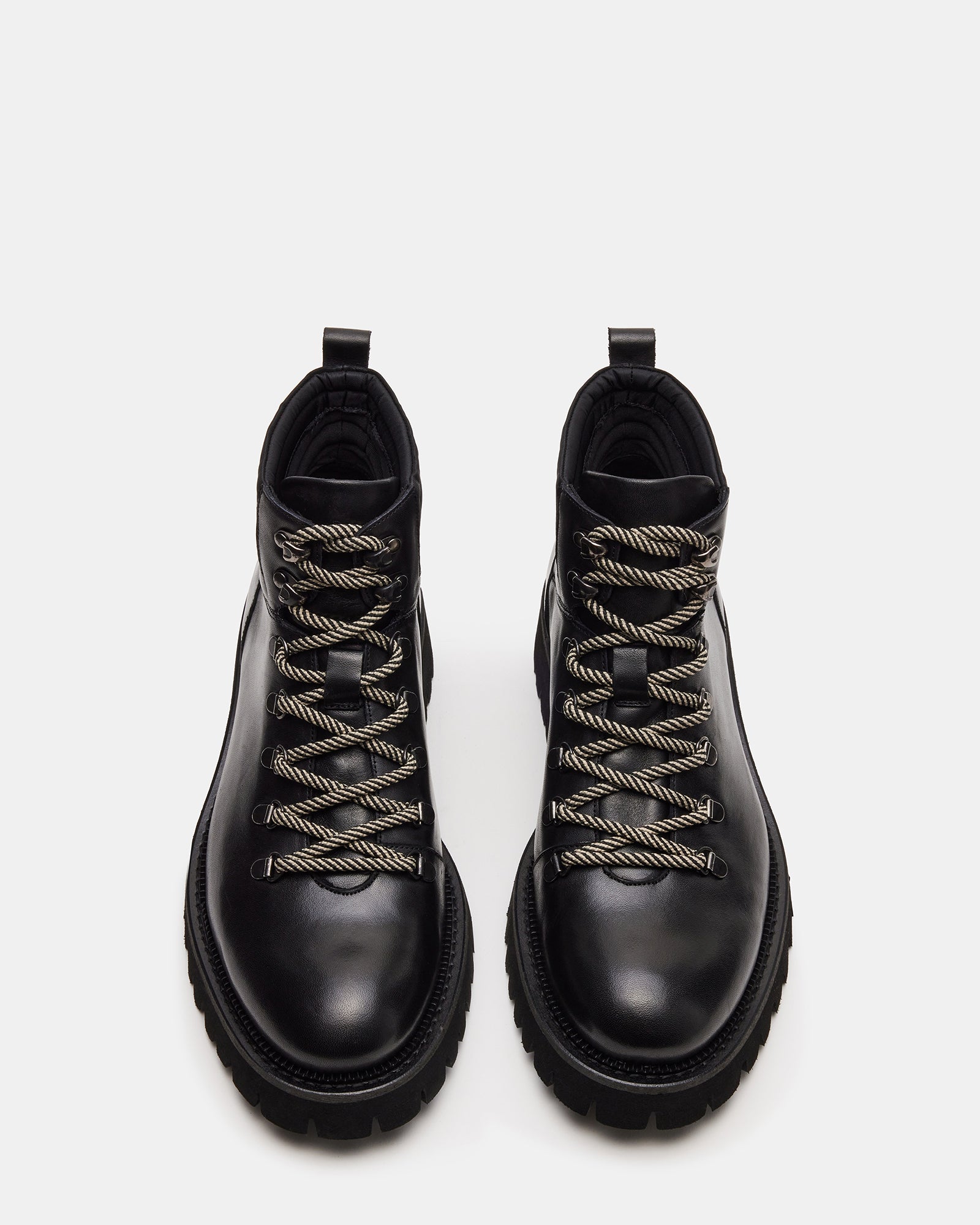 Side view of Fergus black leather boots showing lace-up detail