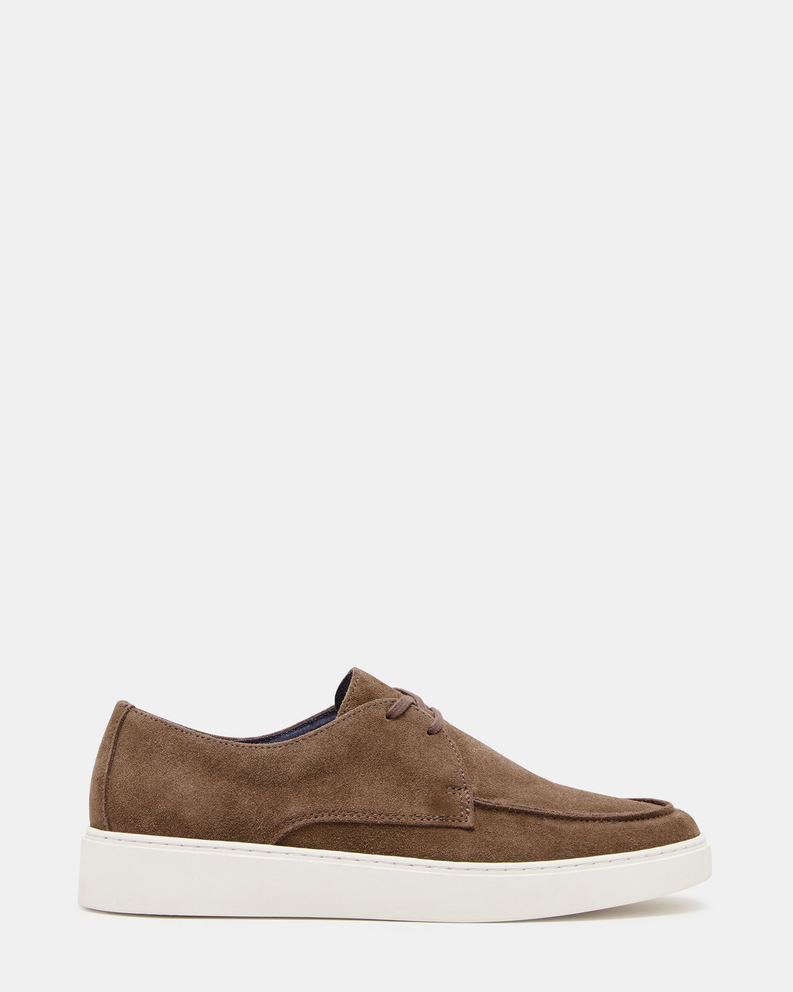 Side view of Frankk cognac suede lace-up shoes styled with denim