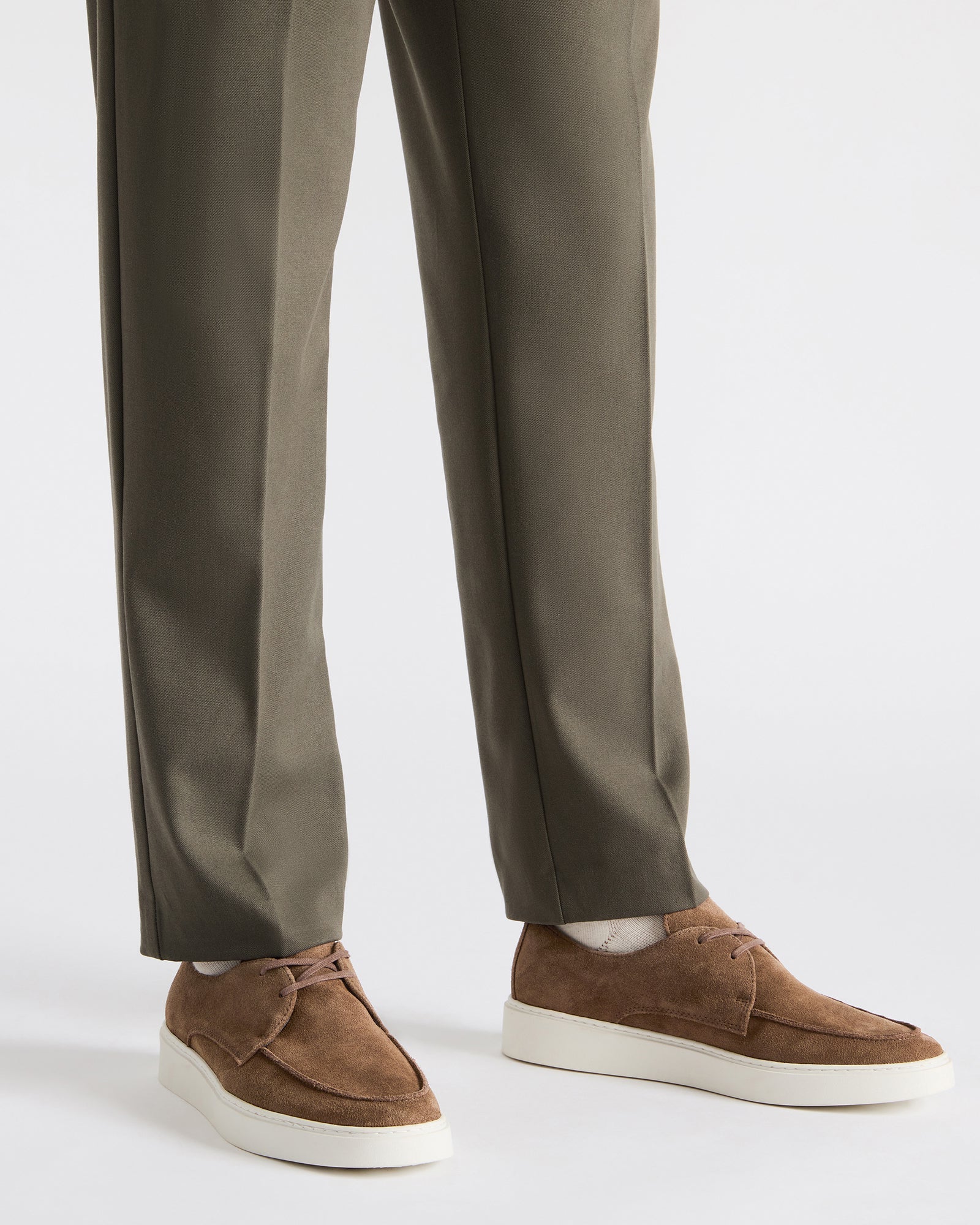 Close-up of suede texture and stitching on mens casual dress shoes