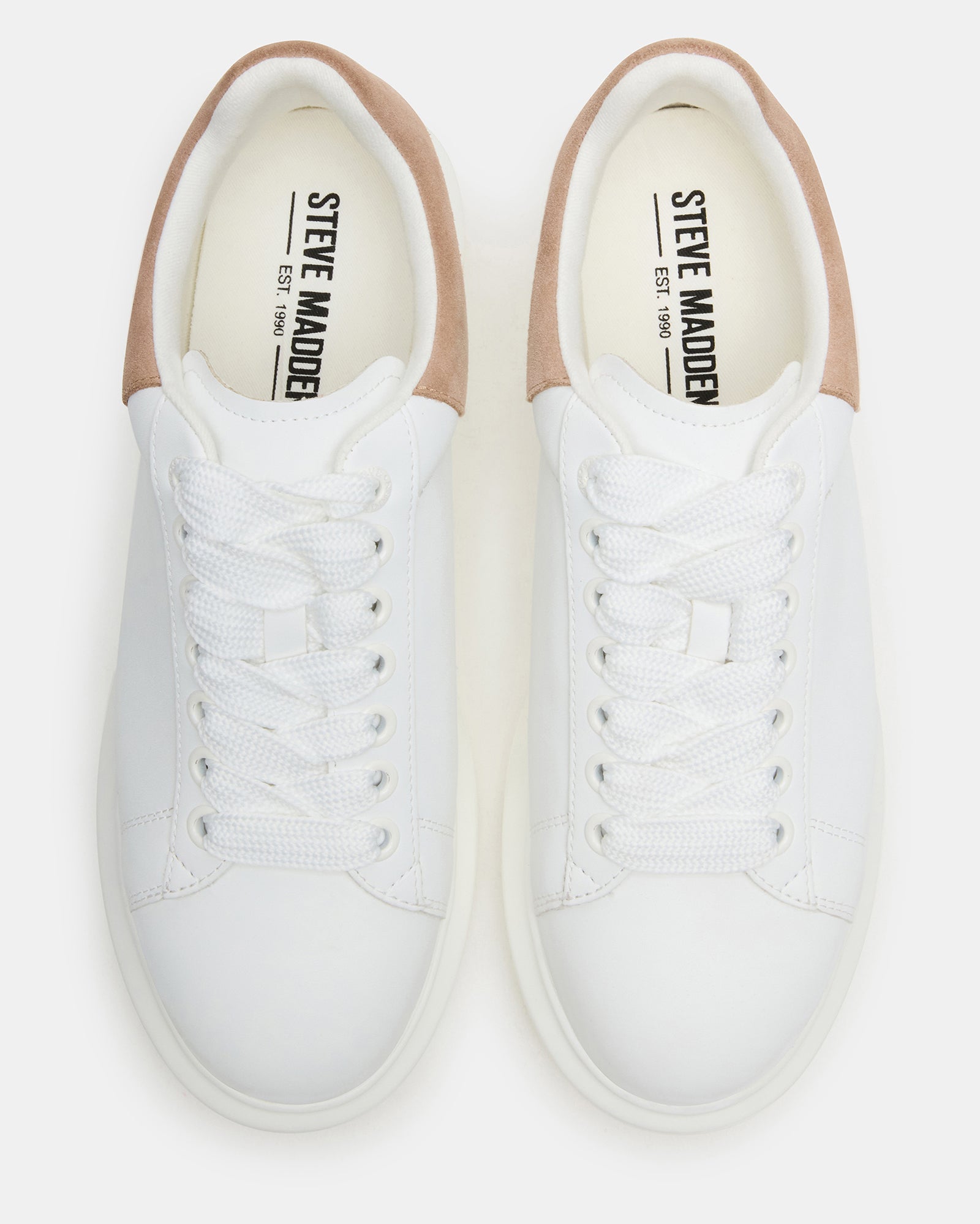 Side profile of white platform sneakers showcasing the 1.5-inch heel.