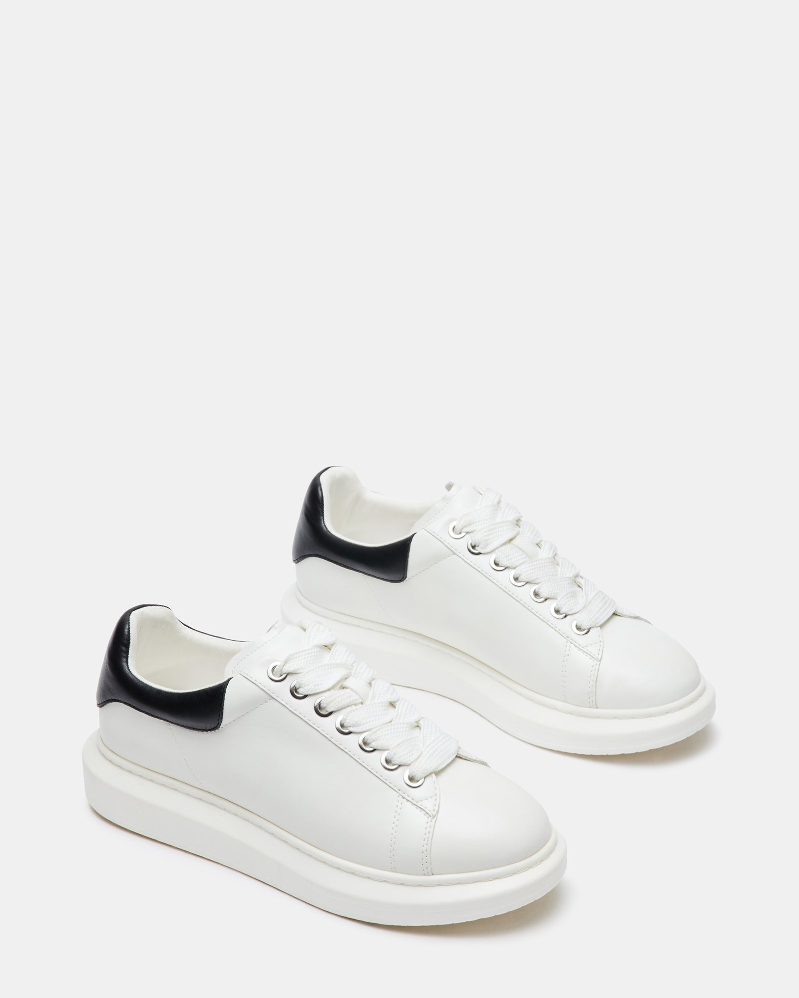 Close-up of rubber sole and heel height on adidas-inspired platform sneaker design