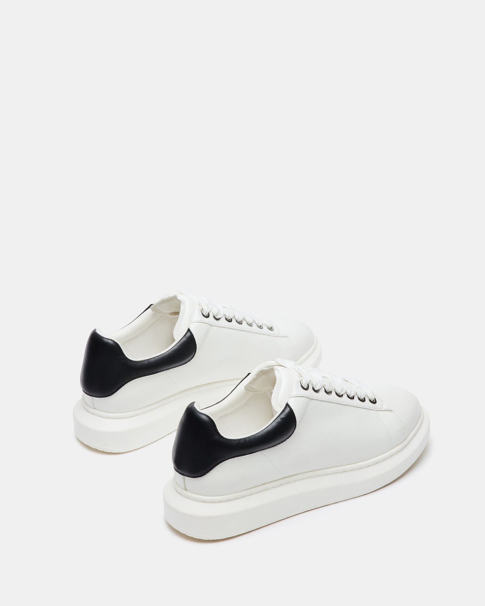 Close-up of rubber sole and heel height on adidas-inspired platform sneaker design