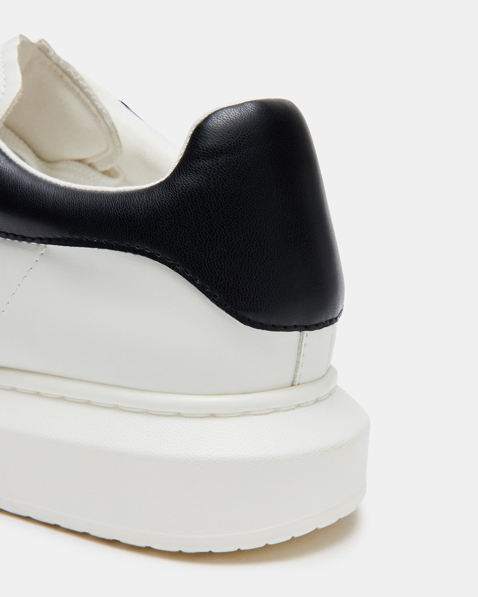 Top view of Frosted Flex sneakers showing lace-up details and padded collar