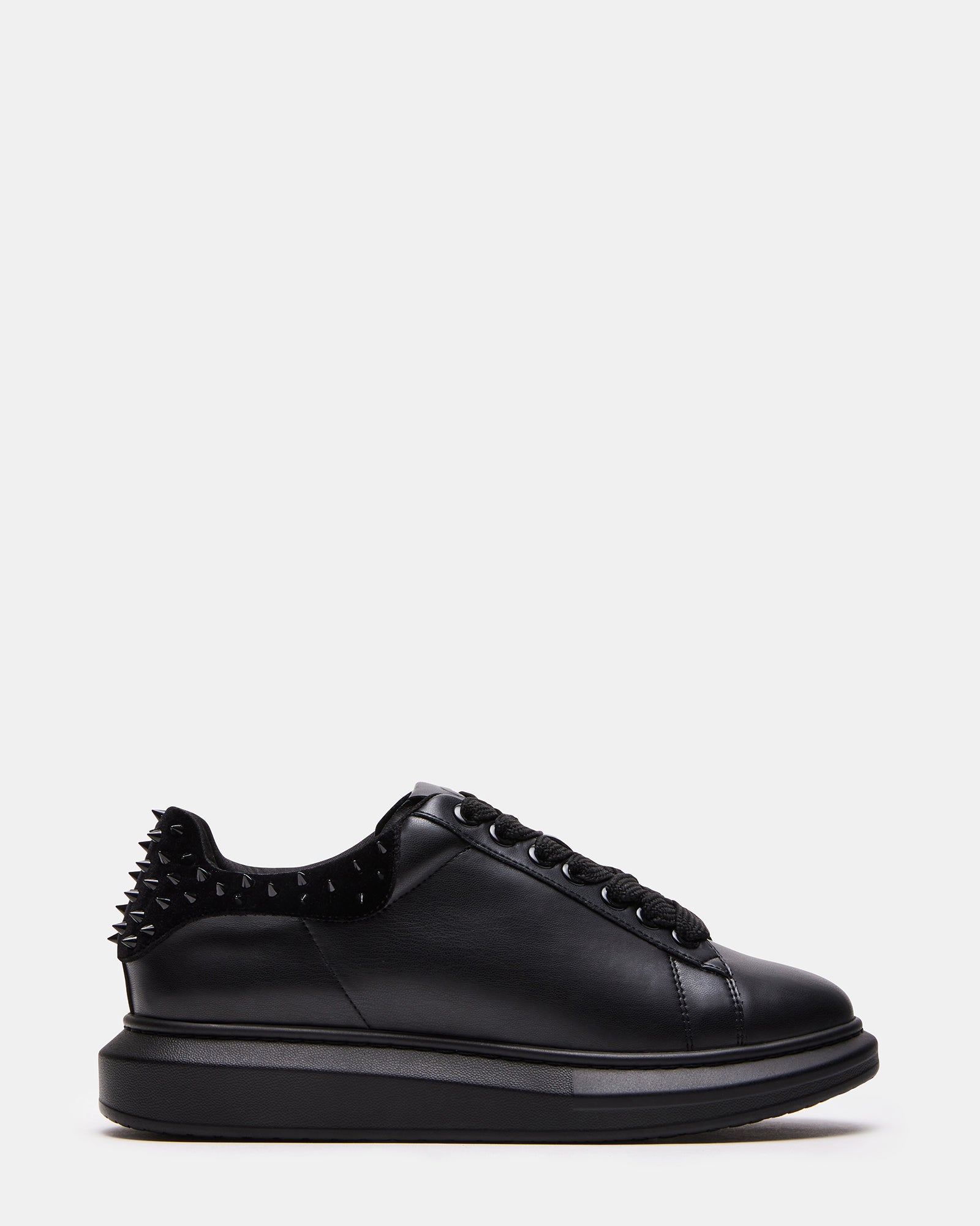 Side view of vegan Flatform Sneakers with spike accents on velvet upper